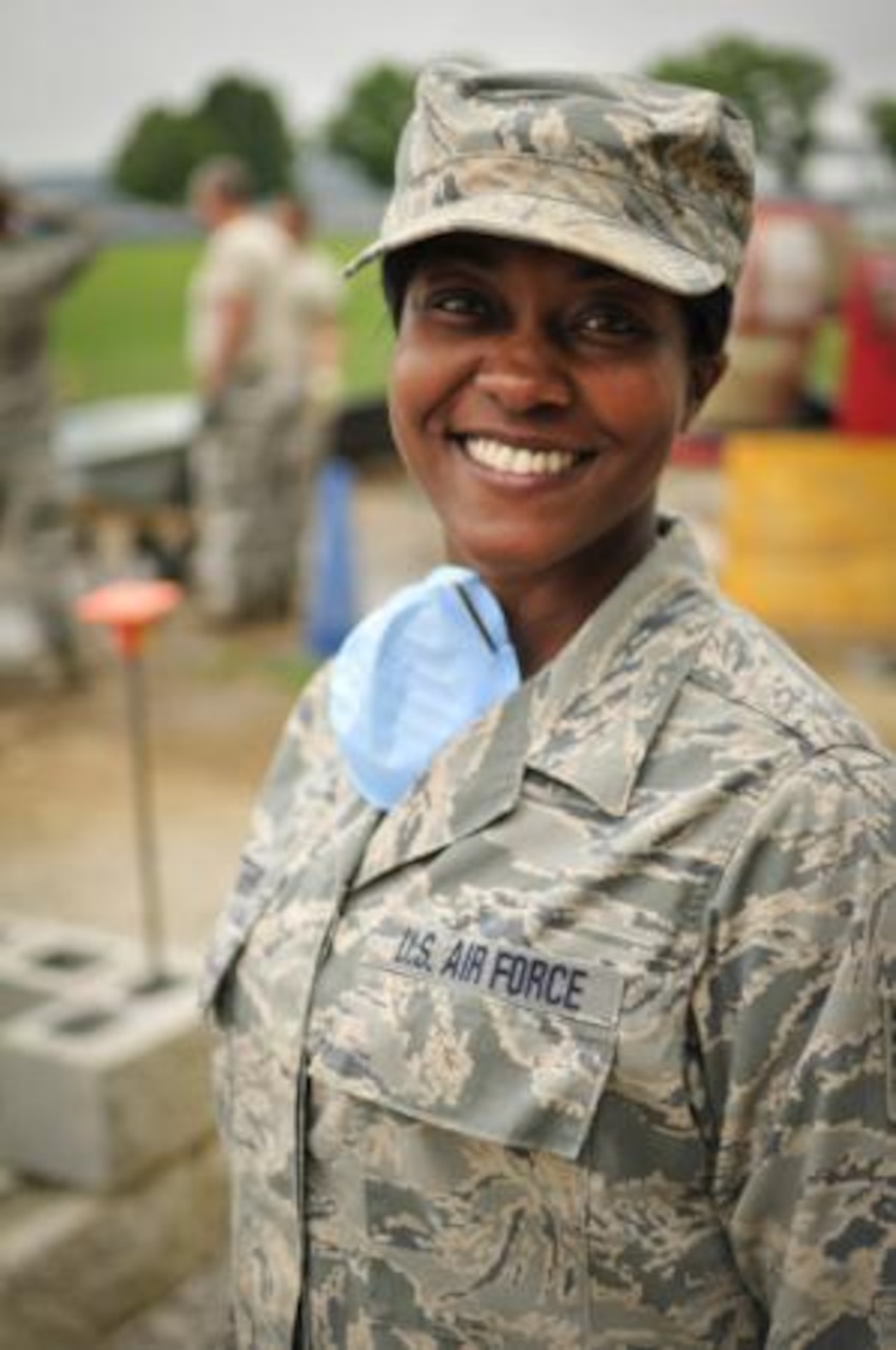 Air Force Tech. Sgt. Jeela Matthews, a member of the Tennessee Air National Guard’s 134th Civil Engineer Squadron with the 134th Air Refueling Wing based in Knoxville, assists in the construction of a new building at the U.S. Coast Guard Academy in New London, Conn. Teamwork is highly emphasized in the military and service members are encouraged to work together to get tasks completed efficiently. U.S. Air National Guard photo by Air Force Staff Sgt. Ben Mellon, 134th Air Refueling Wing Public Affairs