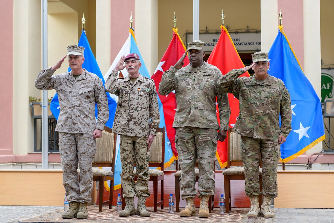 From left to right, U.S. Marine Corps Gen. Joseph H. Dunford Jr., commander of U.S. and NATO forces in Afghanistan; German Army Gen. Hans-Lothar Domröse, commander of Joint Force Command Brunssum; U.S. Army Gen. Lloyd J. Austin III, commander of U.S. Central Command; and U.S. Army Gen. John F. Campbell render honors during the change-of-command ceremony for NATO's International Security Assistance Force in Kabul, Afghanistan, Aug. 26, 2014.