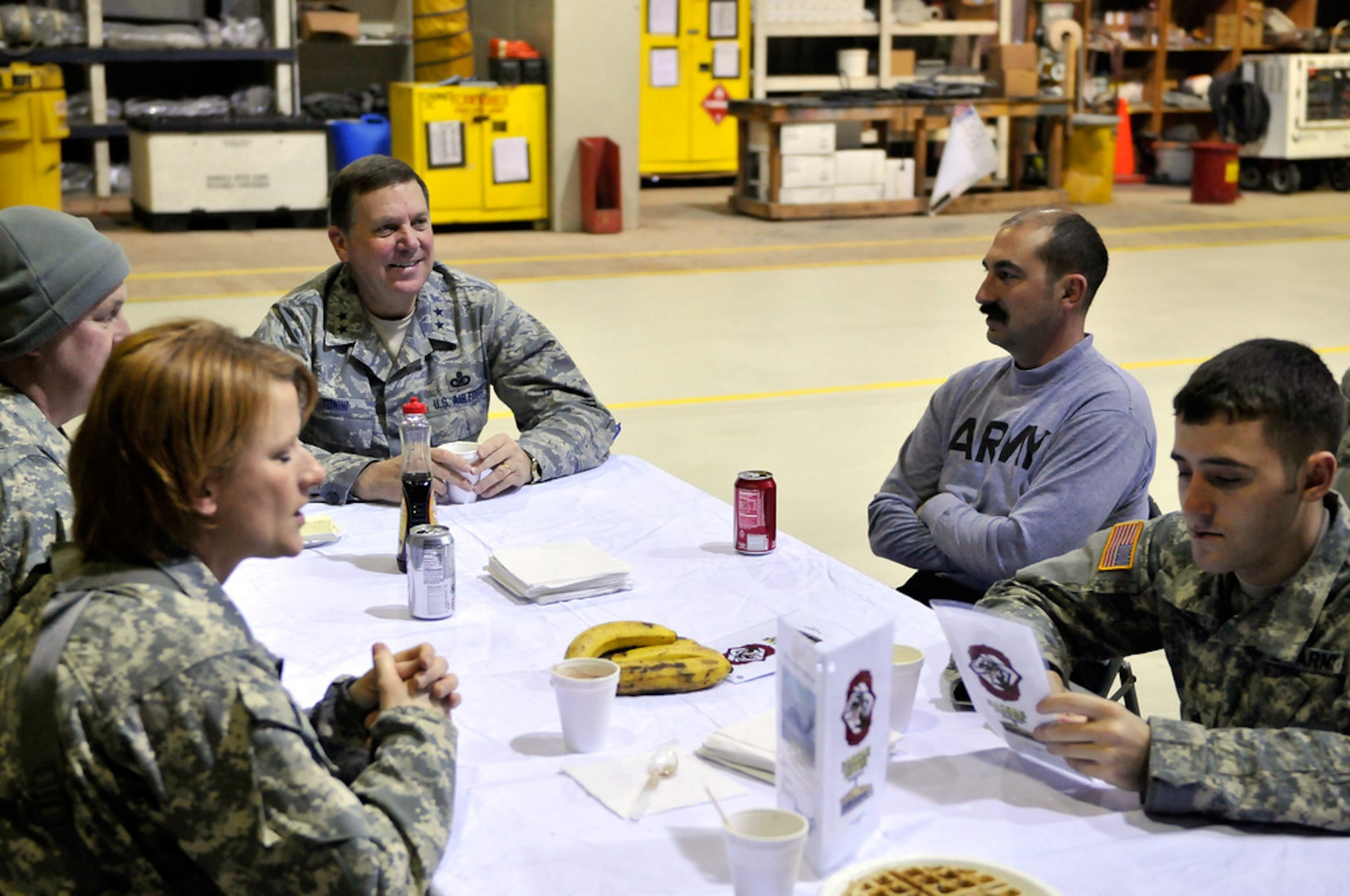 Kentucky National Guard Maj. Gen. Edward W. Tonini chats with members of 2-147th Aviation Battalion, including Private 1st Class Jill M. Ashby, during the general's recent visit to Camp Bondsteel in Kosovo. The Kentucky National Guard has two units - 2-147th AV BN and the 69th Aviation Battalion - deployed there.