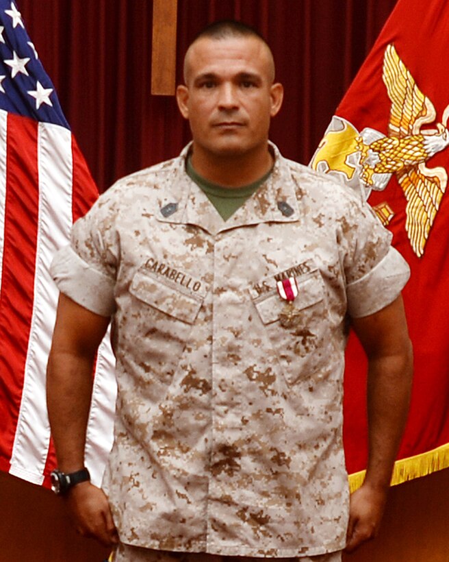 Master Sgt. Mark Carabello, operations and training chief, Operations and Training Division, Marine Corps Logistics Base Albany, receives the Meritorious Service Medal during his retirement ceremony at the Chapel of the Good Shepherd, here, Aug. 25.