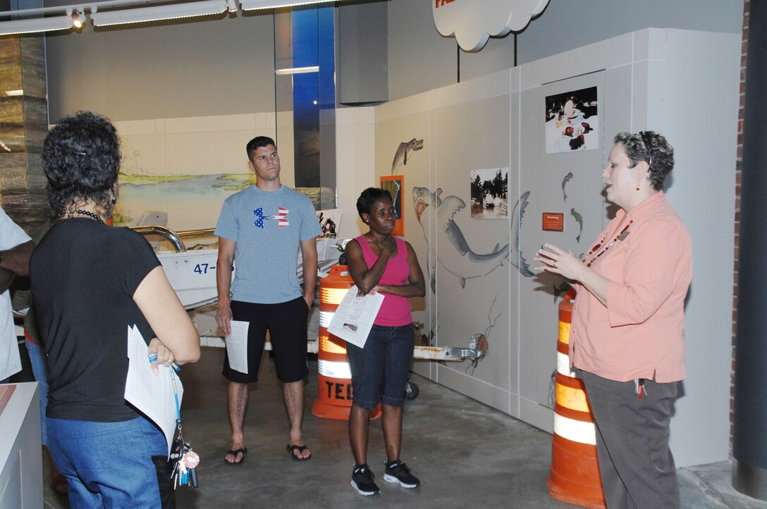 Lisa Lofton, program coordinator, Thronateeska Heritage Center, tells of survival and rescue stories during the 1994 flood in Albany, Ga., to the public affairs staff during a recent visit.