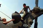 Spc. Aaron DeAngelis, a crew chief, Company C, 3/238th Aviation (Medevac) of the New Hampshire National Guard, and Spc. Andy Weis of the Michigan National Guard work together to inspect the tail rotor. The group is a joint unit with Soldiers from both New Hampshire and Michigan. They are based at Tallil; Al Kut; and Contingency Operating Base Garry Owen in Iraq. The group functions as an air ambulance unit responding to medical evacuation calls needing a helicopter to get patients to a medical facility quickly.