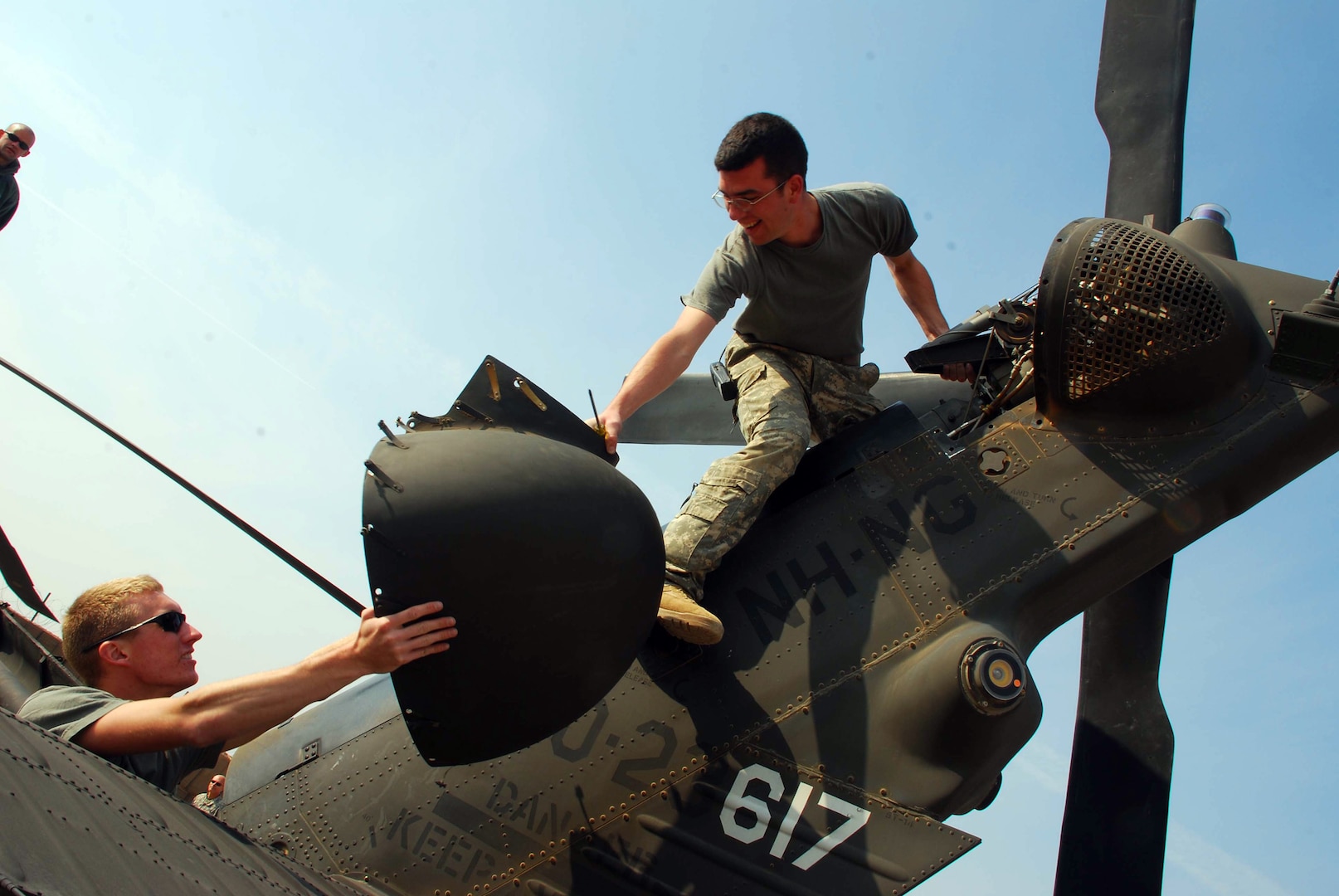Spc. Aaron DeAngelis, a crew chief, Company C, 3/238th Aviation (Medevac) of the New Hampshire National Guard, and Spc. Andy Weis of the Michigan National Guard work together to inspect the tail rotor. The group is a joint unit with Soldiers from both New Hampshire and Michigan. They are based at Tallil; Al Kut; and Contingency Operating Base Garry Owen in Iraq. The group functions as an air ambulance unit responding to medical evacuation calls needing a helicopter to get patients to a medical facility quickly.