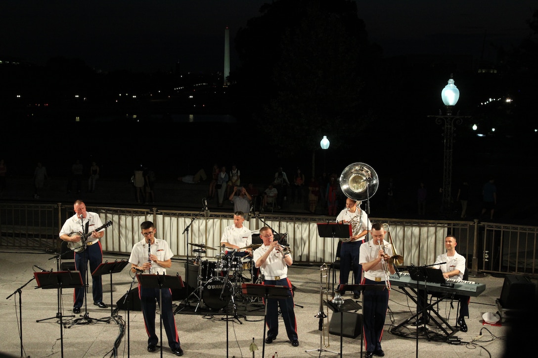 On Aug. 27, 2014, the Marine Dixieland Band performed at the West Terrace of the U.S. Capitol in Washington, D.C. The group is comprised of trumpet player Gunnery Sgt. Daniel Orban, clarinet player Gunnery Sgt. Gregory Ridlington, trombone player Staff Sgt. Ryan McGeorge, pianist Gunnery Sgt. Russell Wilson, guitar player Gunnery Sgt. Alan Prather, drummer Master Sgt. David Murray, sousaphone player Gunnery Sgt. Mark Thiele, and guest clarinetist Master Sgt. Jihoon Chang. (U.S. Marine Corps photo by Master Sgt. Kristin duBois/released)