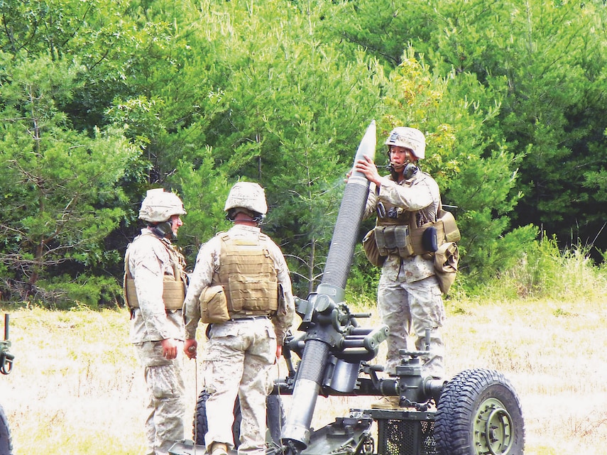 Marines from Marine Corps Base Camp Lejeune, N.C., Gold Company, 2nd Battalion, 10th Marine Regiment prepare to fire the Expeditionary Fire Support System from Marine Corps Base Quantico's Weapons Range 3 on Aug. 20.
