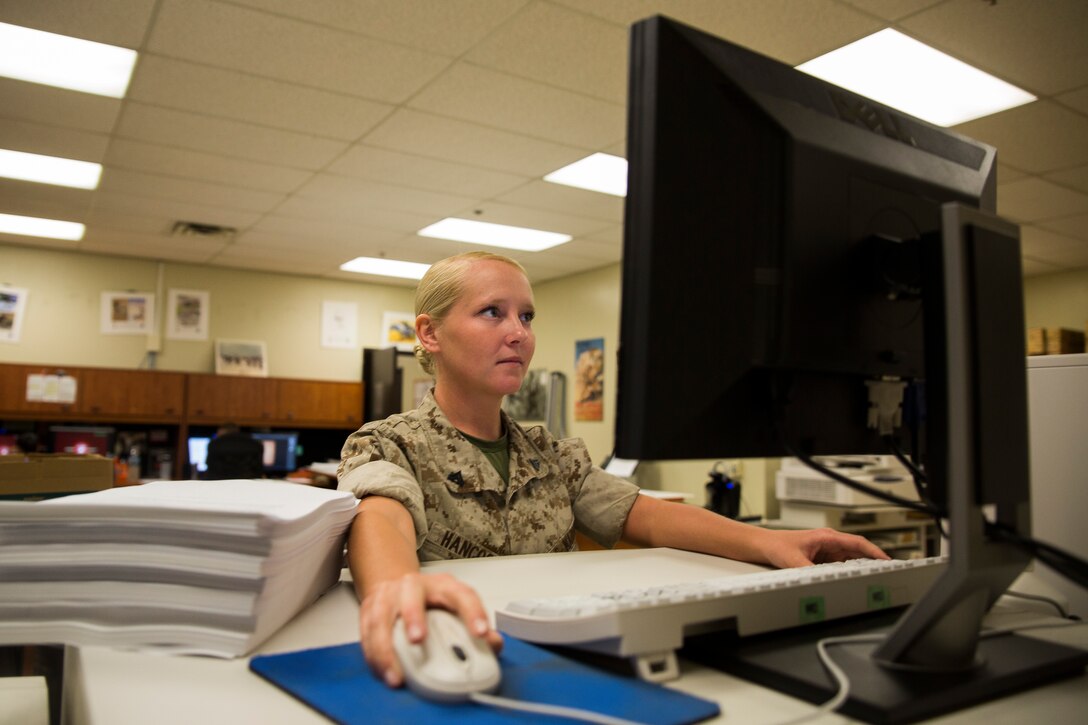Cpl. Megan Hancock, a native of Sheridan, Ill., has been a reproductions specialist at Marine Barracks Washington, D.C., since 2012, Aug. 26, 2014. As with many other Marines, Hancock said she had to adjust to the changes that come with moving to a city. (Official Marine Corps photo by Cpl. Dan Hosack/Released)