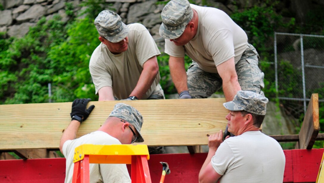 Members of the 134th Air Refueling Wing's Civil Engineer Squadron put their skills to work to construct a new building at the U.S. Coast Guard Academy, New London, Conn. during a DFT.  Collaborations such as this between sister services is a win-win for all.  (U.S. Air National Guard photo by Staff Sgt. Ben Mellon)