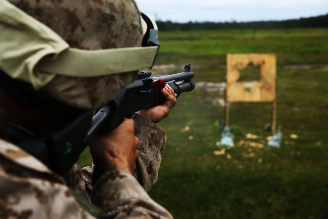 Lance Cpl. Nathan Nguyen fires a M-1014 combat shotgun during a live-fire range at Marine Corps Base Camp Lejeune, N.C., Aug. 25, 2014. Nguyen is an aviation communications technician with Marine Air Support Squadron 1.