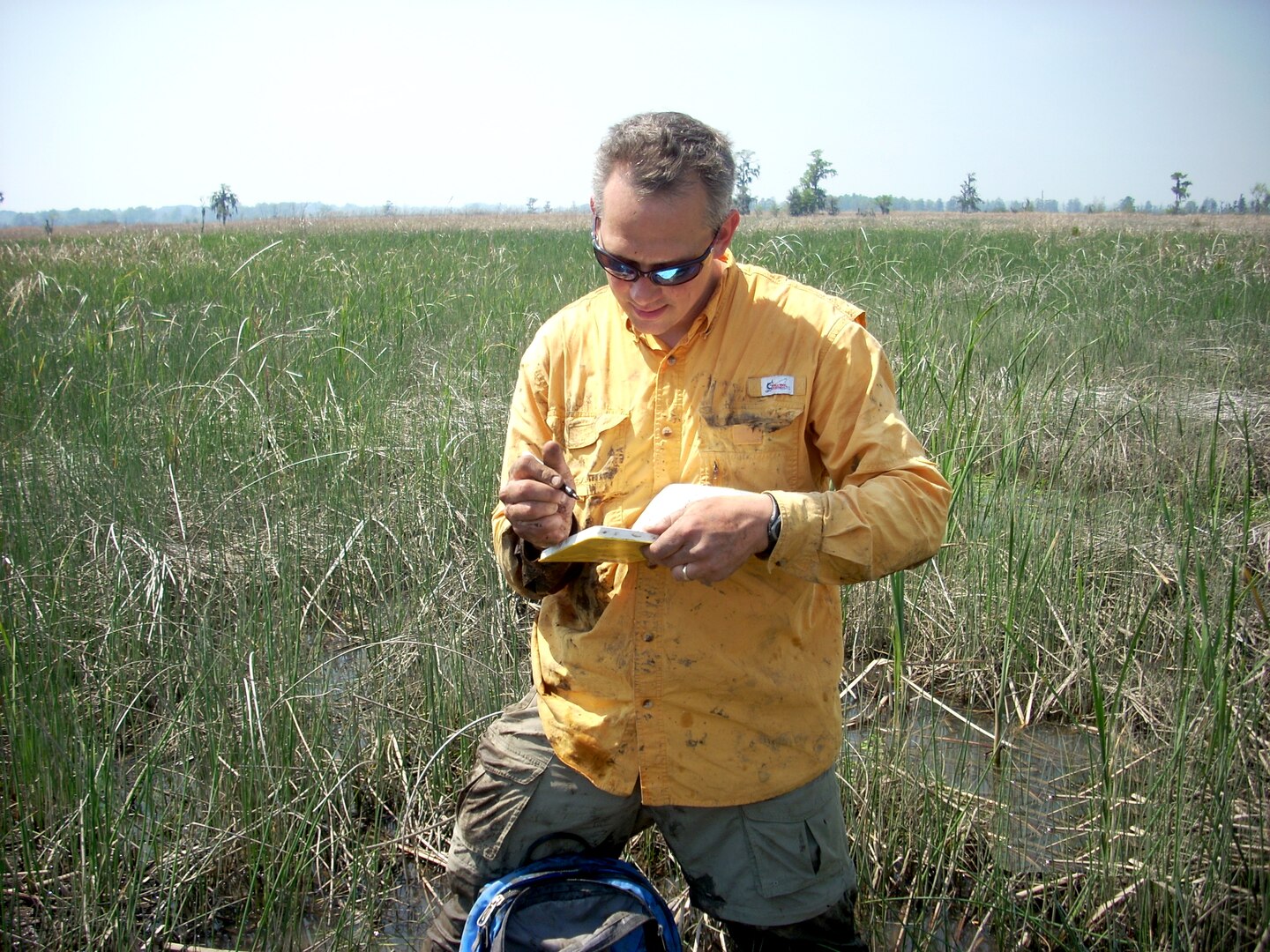 Jamie Duberstein, Clemson research assistant professor, records data at a marsh site in the Savannah River estuary, April 2, 2014.
