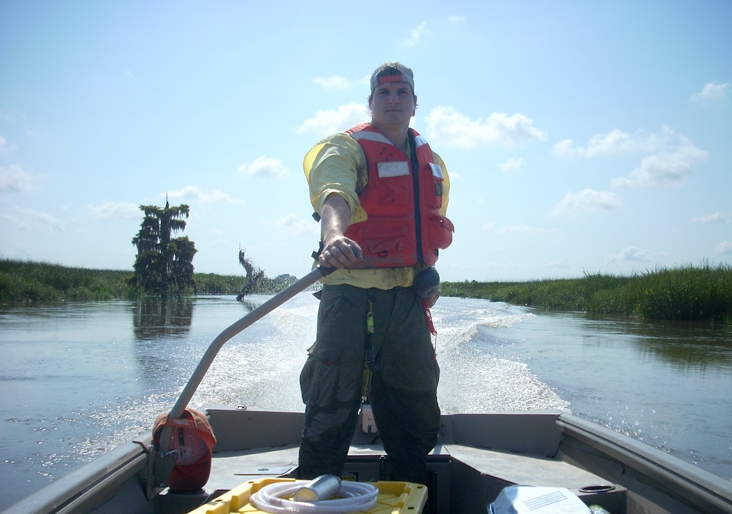Josh Salter, Clemson research technician, navigates a research vessel in the Savannah River estuary, June 16, 2014.