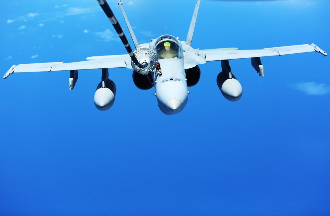 An F/A-18C Hornet with Marine Fighter Attack Squadron 122 receives fuel from an Air Force KC-10 Extender over the Pacific Ocean, August 23, 2014. The Hornet flew from Hawaii to Eielson Air Force Base in Alaska. While in Alaska, VMFA-122, nicknamed the “Werewolves,” is scheduled to conduct unit level training and fly with squadrons from the United States Air Force to enhance interoperability between services.  