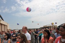 Members of the 911th Airlift Wing and their families bounce beach balls to each other as part of a demonstration during a commander’s call at Pittsburgh International Airport Air Reserve Station, August 2, 2014. (U.S. Air Force photo by Senior Airman Marjorie A. Bowlden)