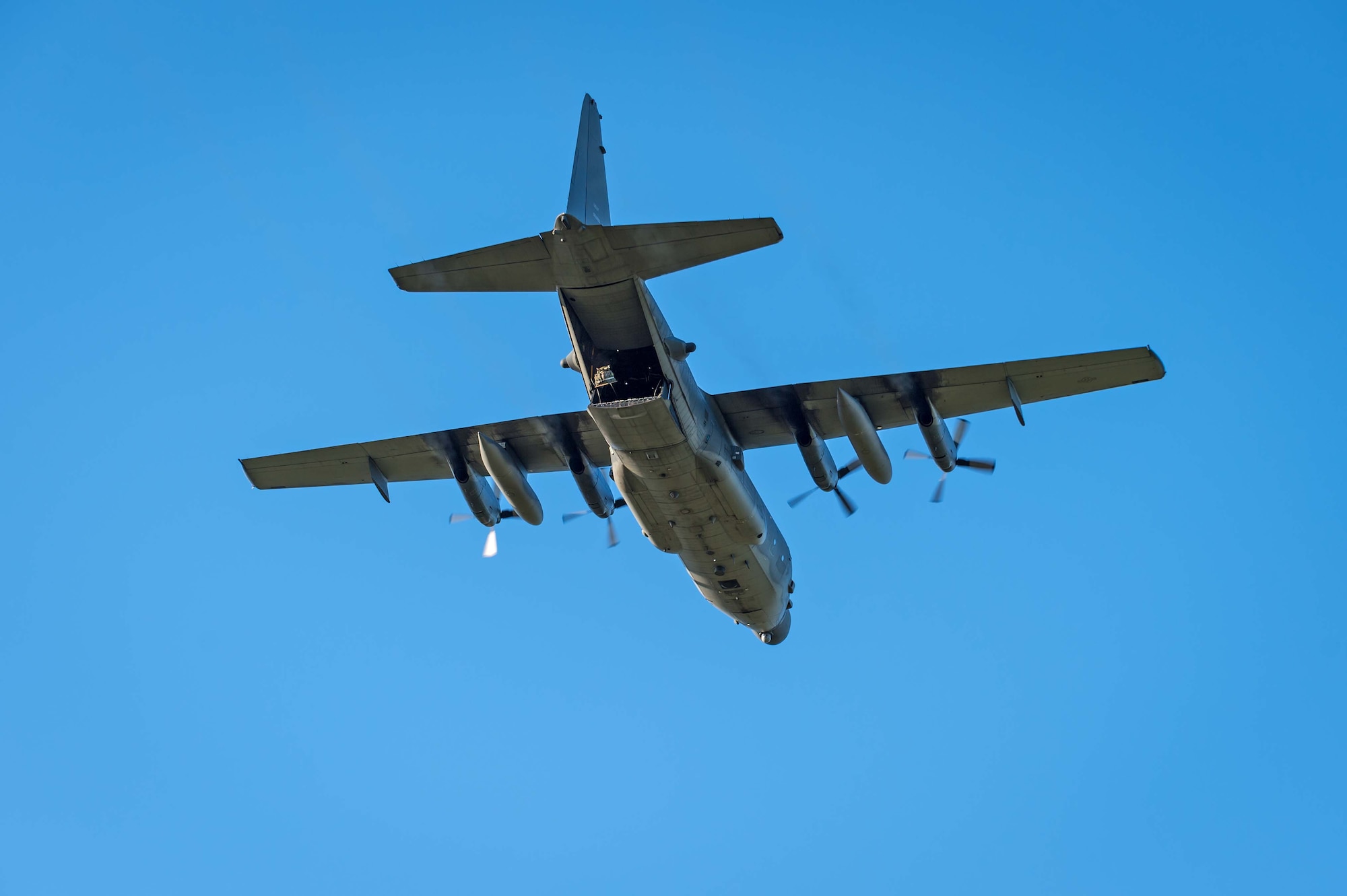 An MC-130H Combat Talon II from the 1st Special Operations Squadron conducts an airdrop July 28, 2014 over a drop zone in New Zealand.   The 353rd Special Operations Group trained side by side with their counterparts in the New Zealand Defense Force during Exercise Balance Net July 17-31.  The exercise enhanced interoperability defense relations between the two countries.  (New Zealand Defense Force Photo by Roderick MacKenzie) 
