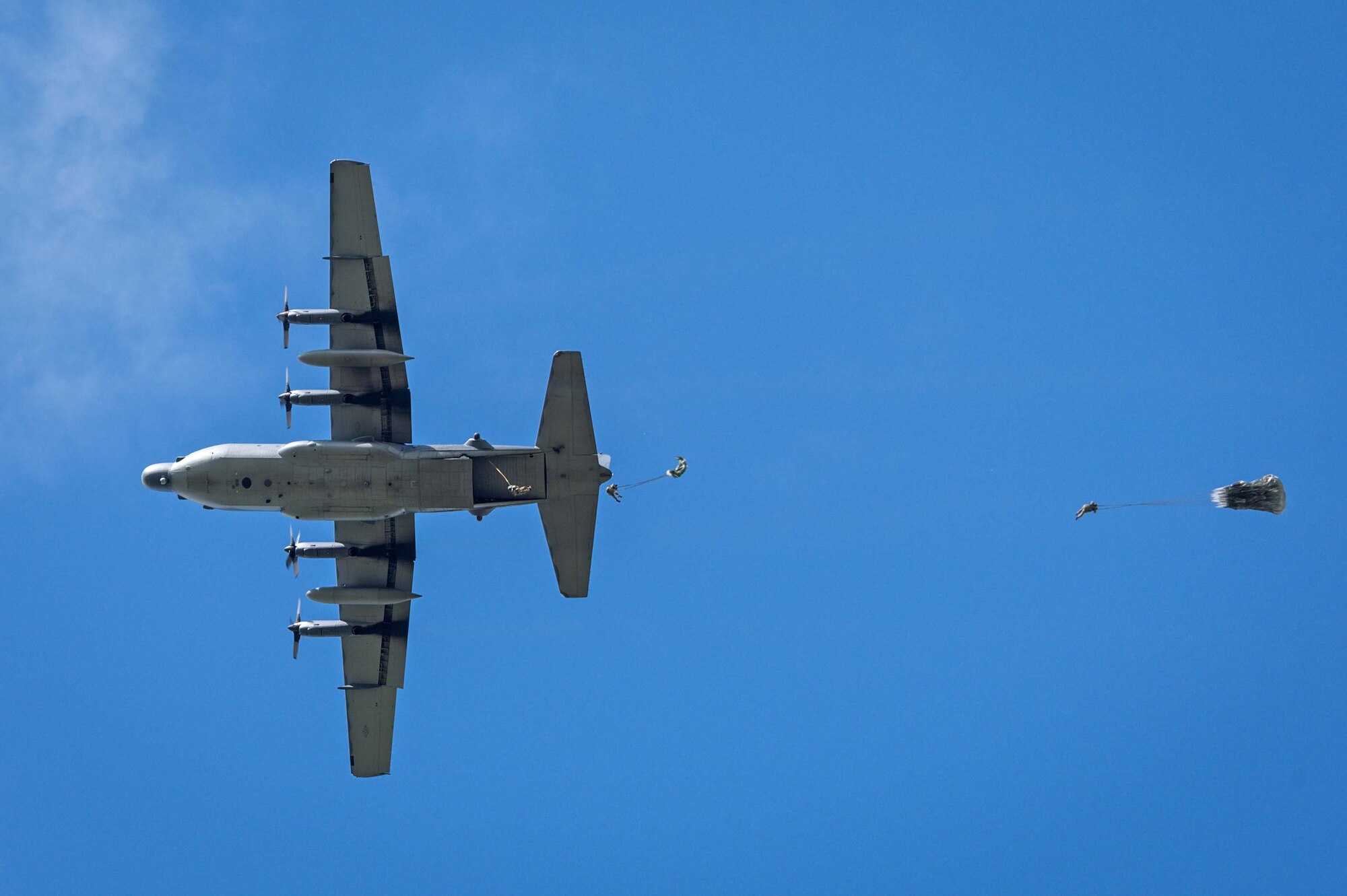 An aircrew from the 1st Special Operations Squadron conducts personnel drops from an MC-130H Combat Talon II July 30, 2014 over a drop zone in New Zealand.  Exercise Balance Net was a 2-week exercise designed to enhance interoperability between the New Zealand Defense Force and the U.S. Air Force. (New Zealand Defense Force Photo by Roderick MacKenzie)