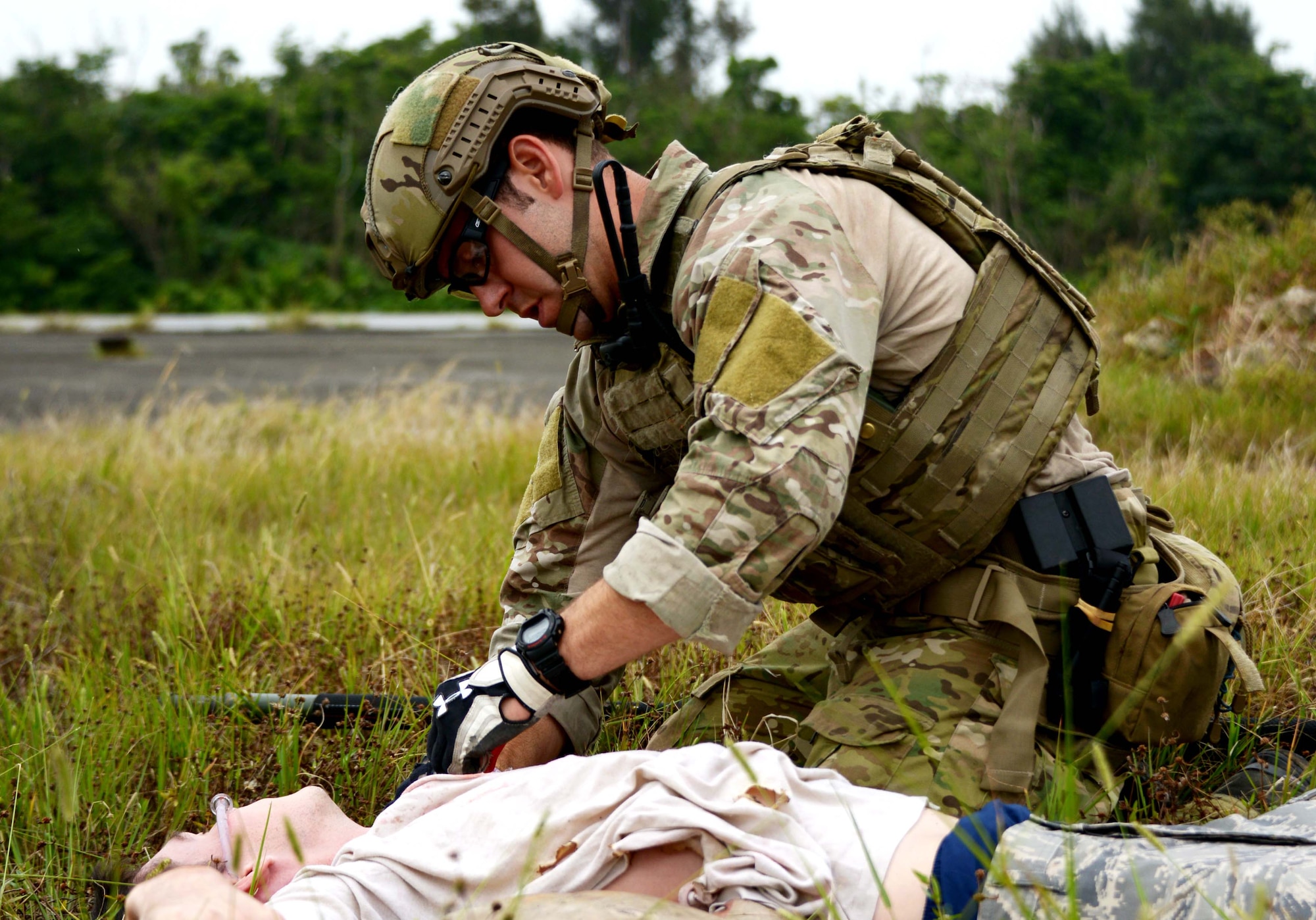 Senior Airman Tristan Windle, a pararescueman with the 320th Special Tactics Squadron, provides medical treatment to a victim during the OSMP training held May 1, 2014 on Kadena Air Base, Japan.  Windle was selected as the 2013 Air Force Sergeants Association Pitsenbarger Award recipient for his heroic actions while deployed in 2013 to Afghanistan in support of Operation Enduring Freedom.  (U.S. Air Force photo by Tech. Sgt. Kristine Dreyer) 