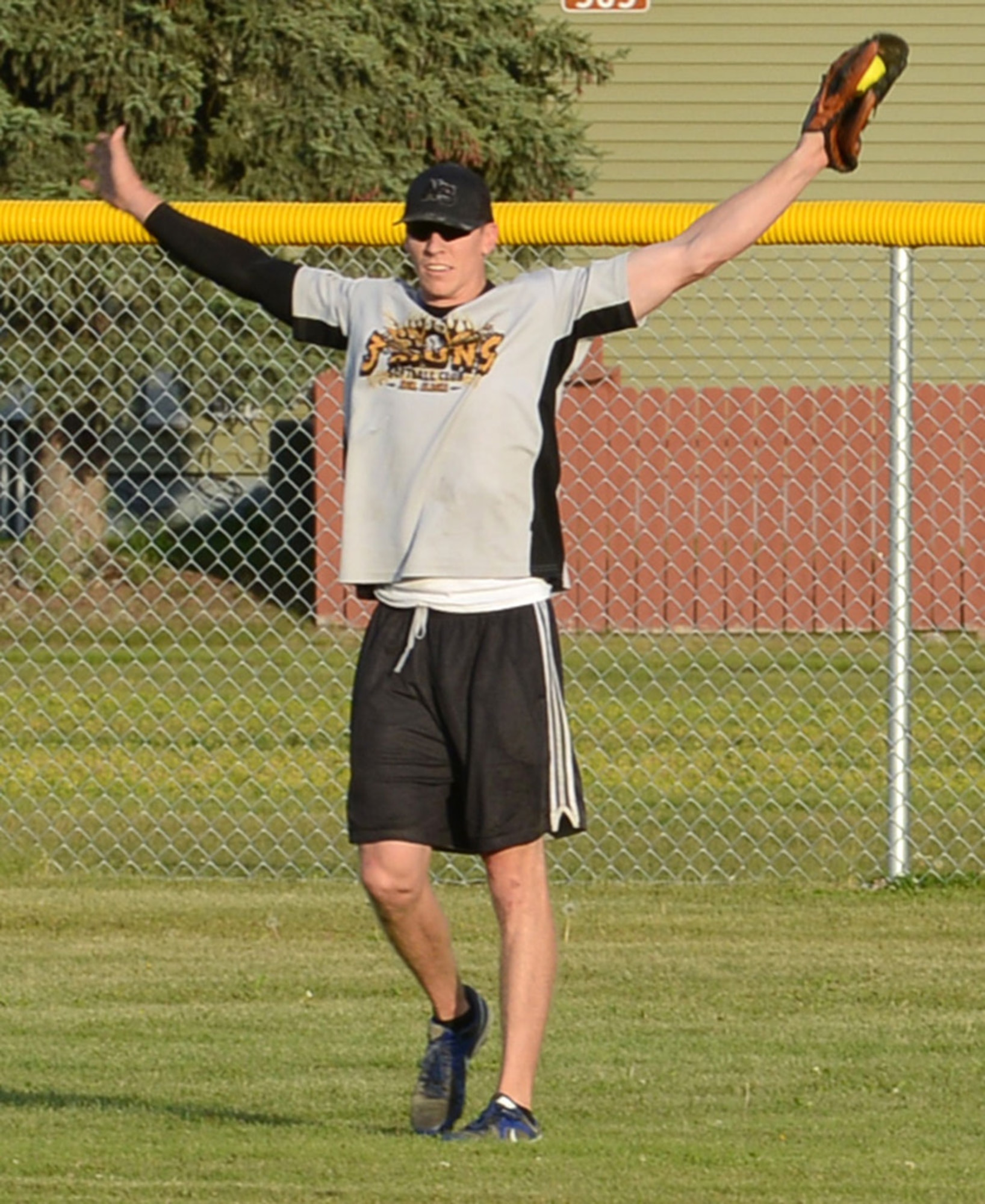 JOINT BASE ELMENDORF-RICHARDSON, Alaska – Bradley Barnes, 3rd Munitions Squadron, celebrates after making the final out of the first of two games to decide the Joint Base Elmendorf-Richardson softball league championship at Buckner Fields on JBER-Richardson August 21. The 3rd MUNS team defeated the team from the 3rd Aircraft Maintenance Squadron in consecutive games to capture the title. (U.S. Air Force photo/Staff Sgt. Blake Mize)