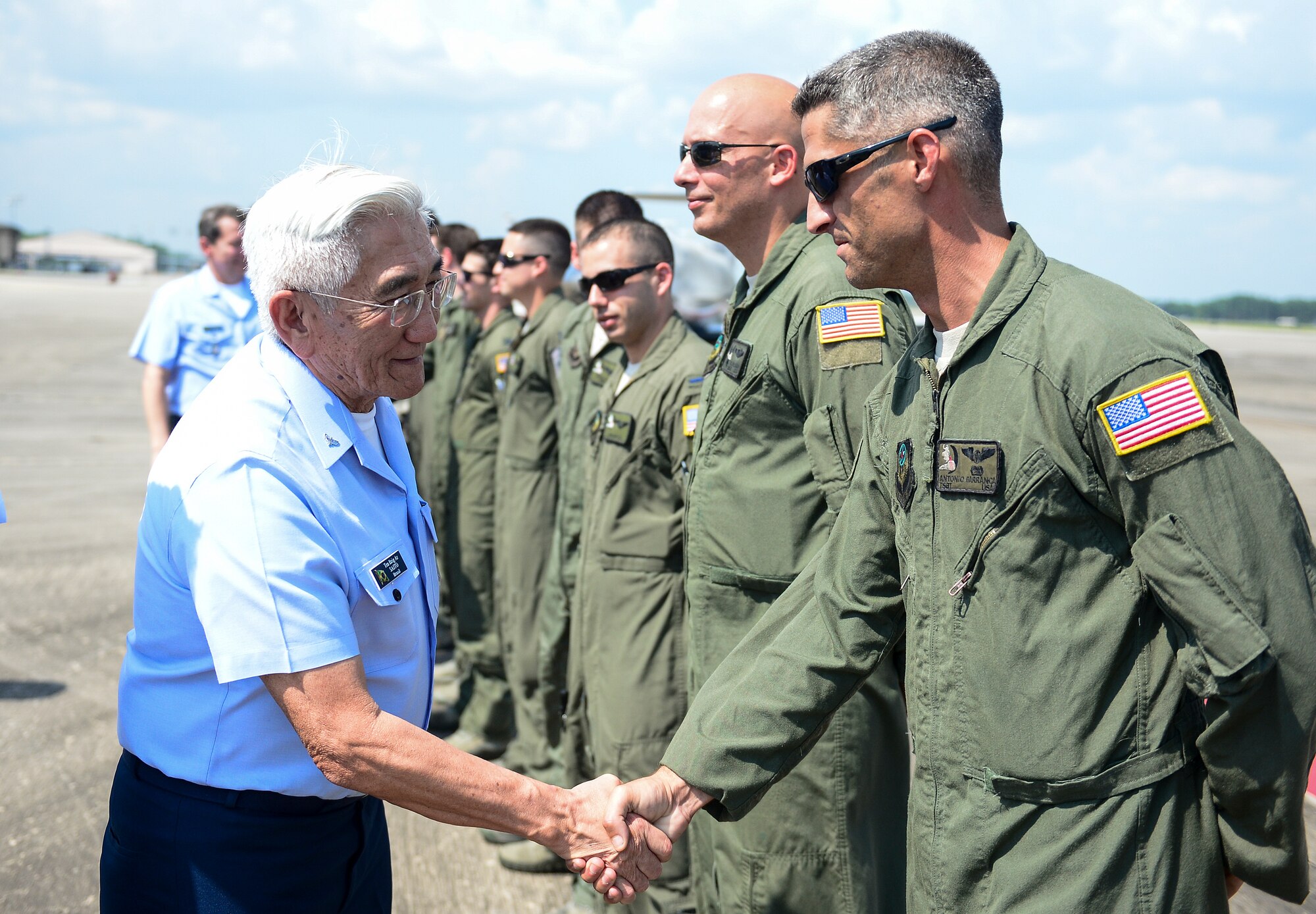 Gen. Juniti Saito, Brazilian Air Force commander, is greeted by Tech. Sgt. Antonio Barranca, 4th Special Operations Squadron special missions’ aviator on the flightline at Hurlburt Field, Fla., Aug. 22, 2014. Saito toured different units on Hurlburt Field as part of the Air Force Chief of Staff Counterpart Program, which helps build, sustain and expand relationships with other nations. (U.S. Air Force photo/Airman 1st Class Jeff Parkinson)