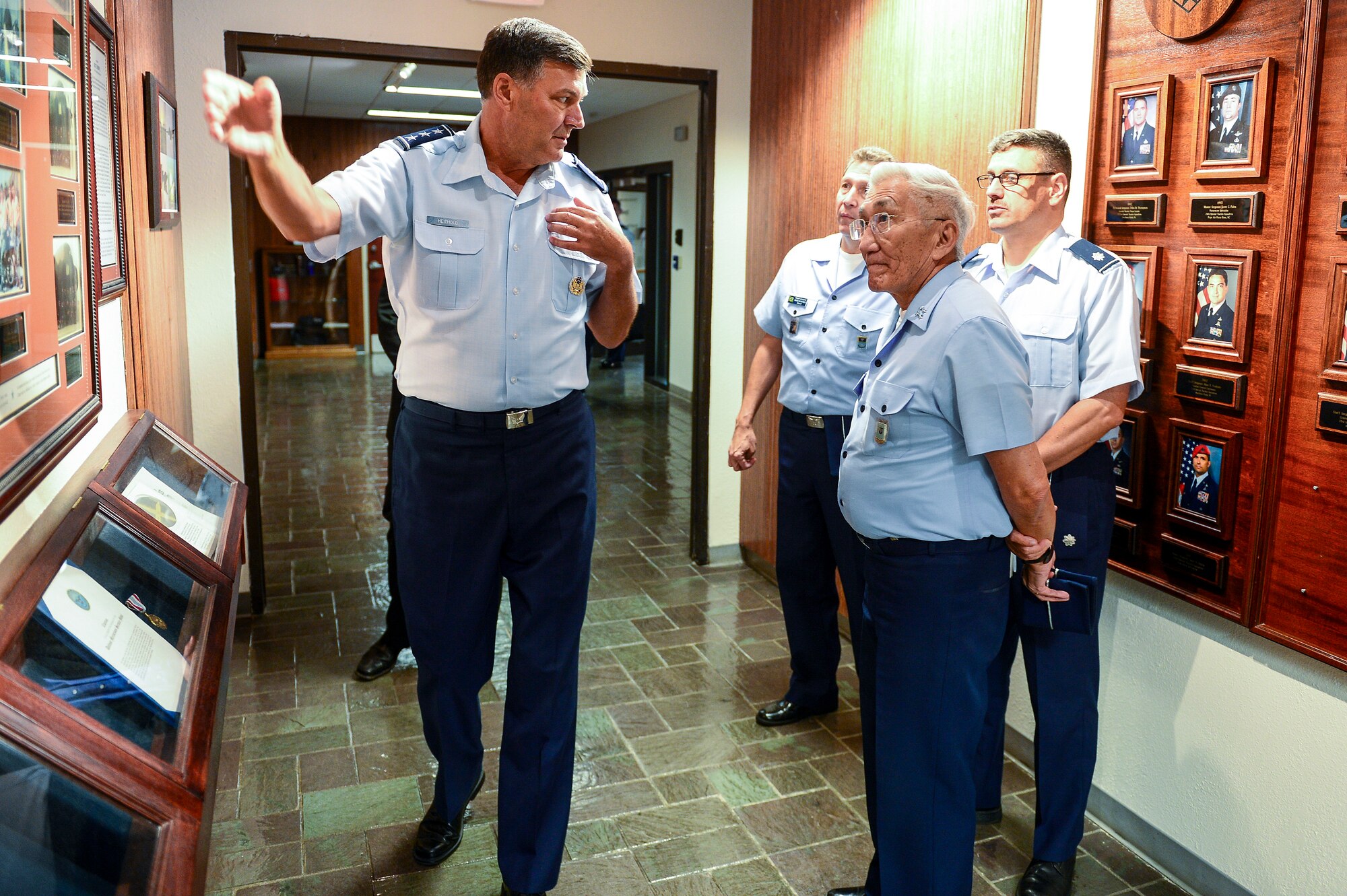 Lt. Gen. Brad Heithold, Air Force Special Operations Command commander, briefs Gen. Juniti Saito, Brazilian Air Force commander, on AFSOC history at command headquarters, Hurlburt Field, Fla., Aug. 22, 2014. Saito toured different U.S. Air Force bases as part of the Air Force Chief of Staff Counterpart Program. (U.S. Air Force photo/Airman 1st Class Jeff Parkinson)
