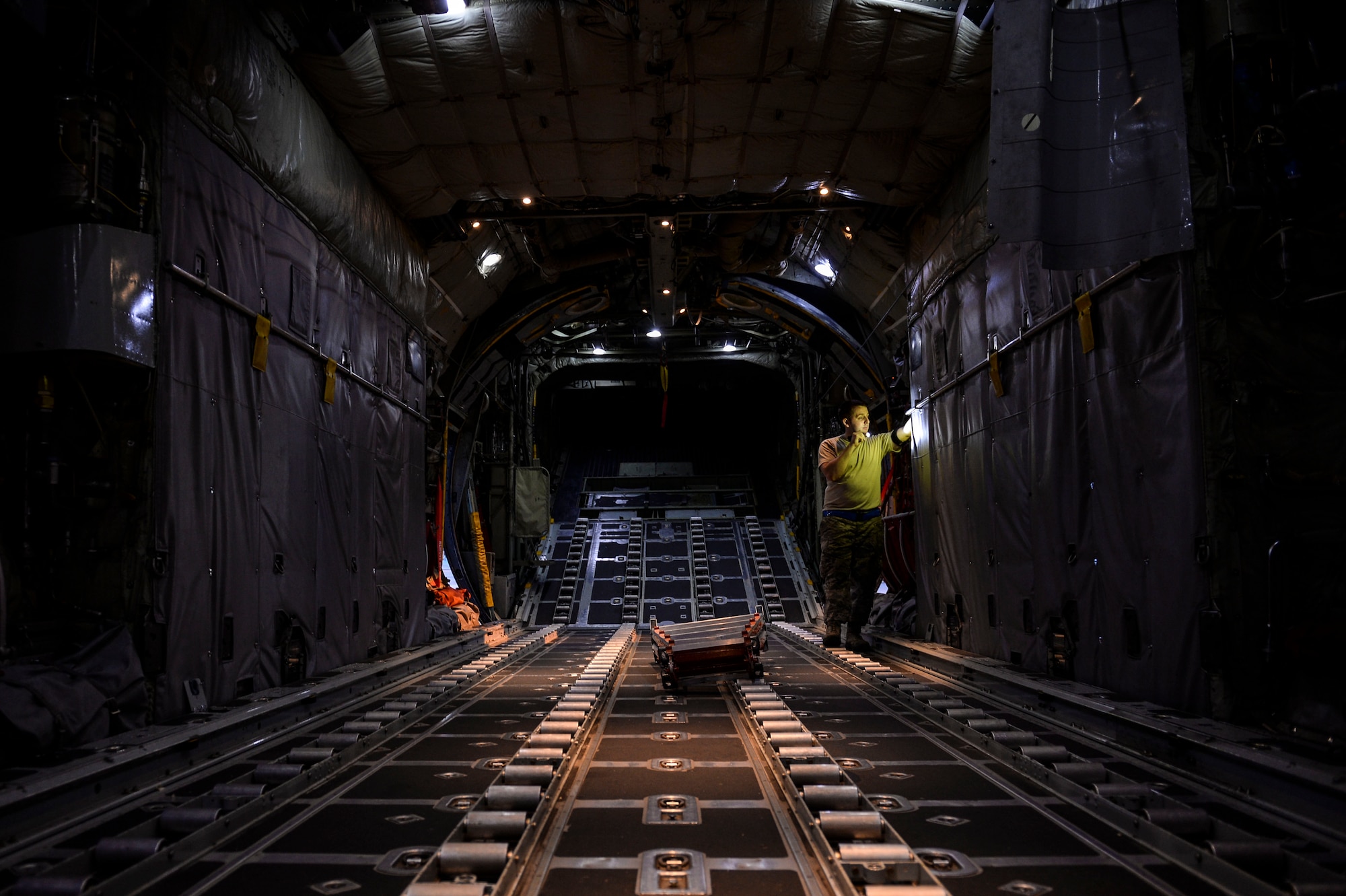 Staff Sgt. Cody Hampton, a 314th Aircraft Maintenance Squadron crew chief, checks the serviceability of a fire extinguisher located in the rear of a C-130H Aug. 18, 2014, at Little Rock Air Force Base, Ark. Every single pre-flight inspection checklist requires 174 routine inspection items to complete in order to guarantee aircraft airworthiness. (U.S. Air Force photo by Airman 1st Class Cliffton Dolezal)
