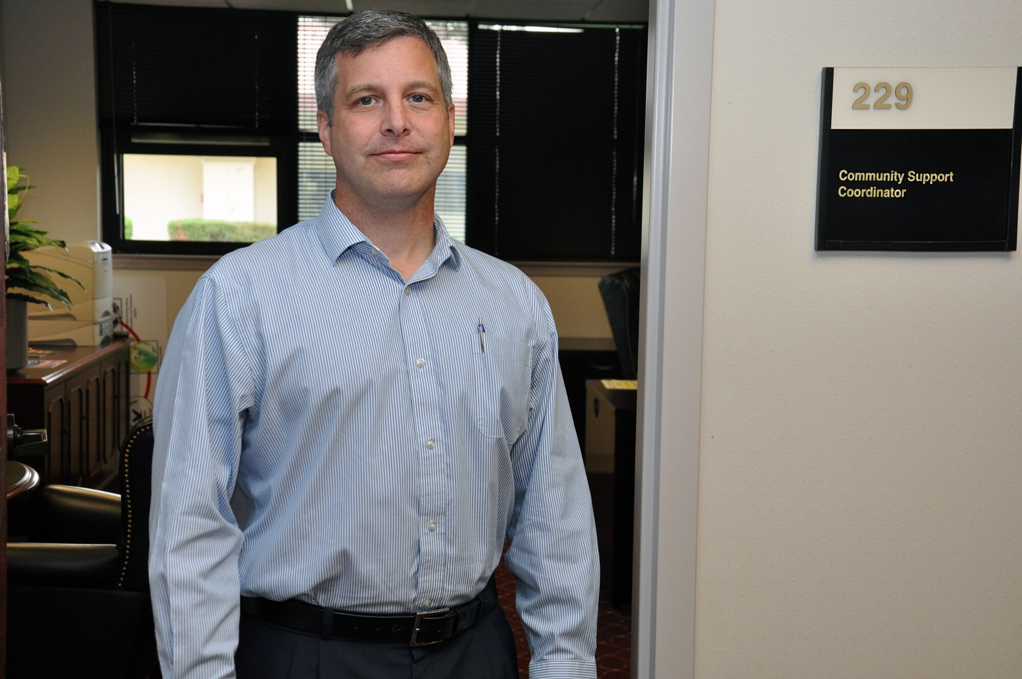Wesley Yancey, 60th Air Mobility Wing Community Support Coordinator stands outside of his office Tuesday at Travis Air Force Base. (U.S. Air Force photo by Staff Sgt. Christopher Carranza)