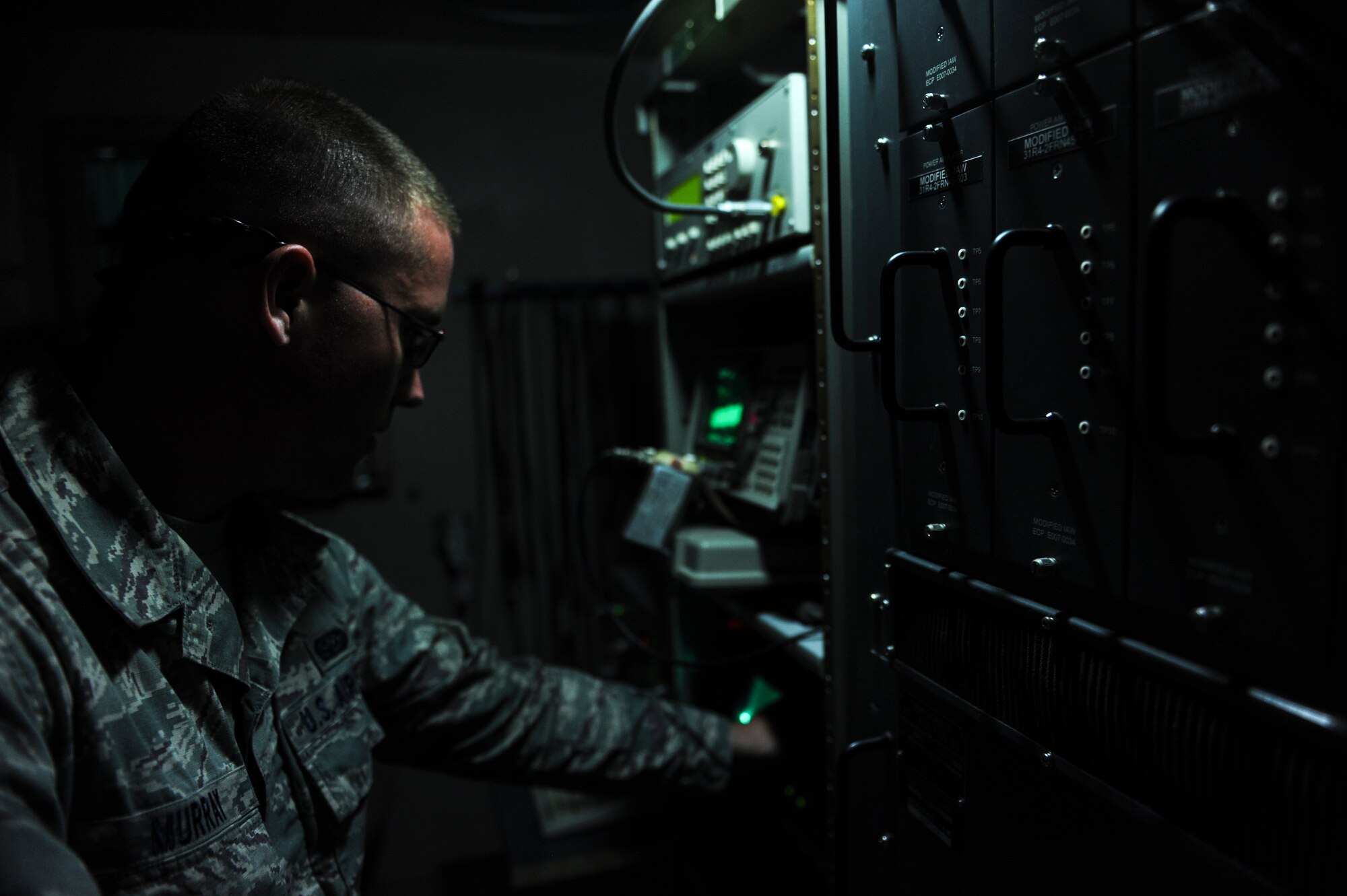 Senior Airman Blaine Murray, a 19th Operations Support Squadron airfield systems technician, analyzes a tactical air navigation system’s monitor signal Aug. 20, 2014, at Little Rock Air Force Base, Ark. By using an oscilloscope, the airfield systems team can do preventative maintenance and catch any minor issues that could later become serious. (U.S. Air Force photo by Airman 1st Class Scott Poe)