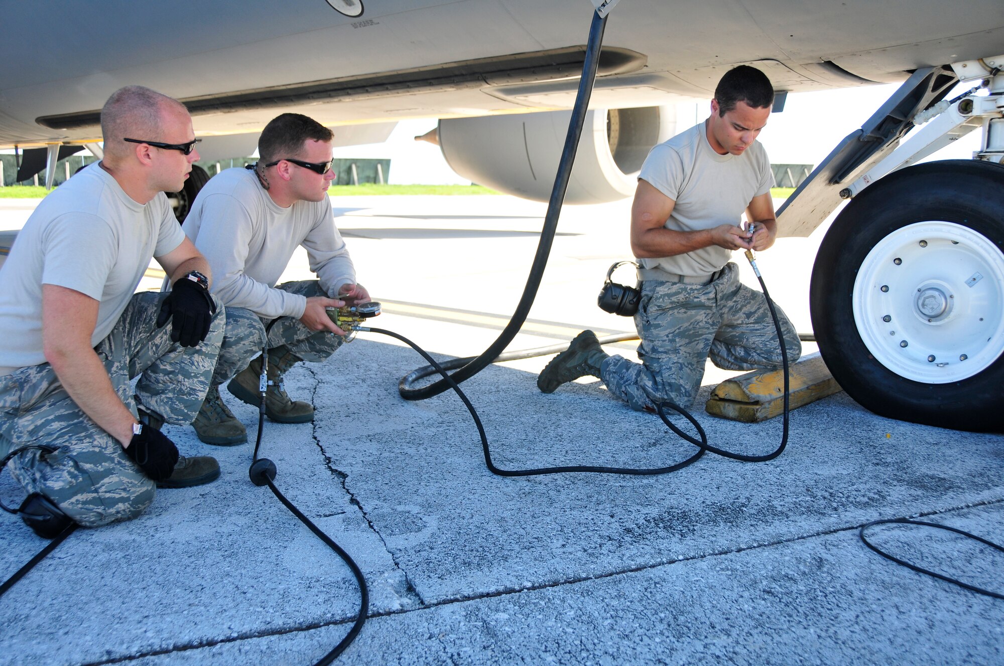 Aircraft Maintainers from the 134th Air Refueling Wing, McGhee Tyson ANG Base, TN check the tire pressure on a KC-135R Stratotanker refueling aircraft at Andersen AFB, Guam during a training mission.  (U.S. Air National Guard photo by Staff Sgt. Ben Mellon, 134 ARW Public Affairs)
