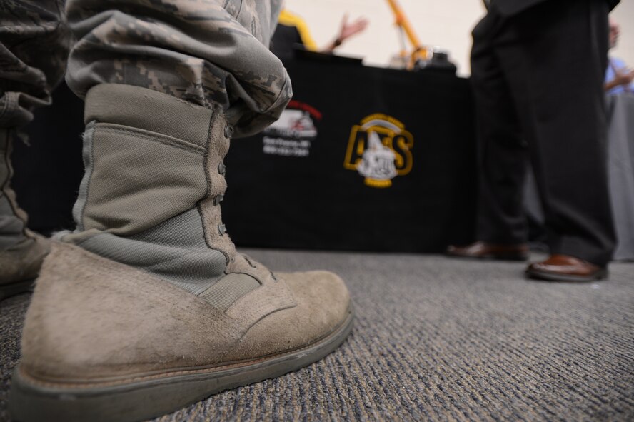 An Airman speaks with a representative of the Associated Training Services during the quarterly job fair at the Community Activity Center Shaw Air Force Base, S.C., Aug. 28, 2014. The job fair gave anyone with military identification the opportunity to meet with local business representatives about possible career opportunities. (U.S. Air Force photo by Senior Airman Tabatha Zarrella/Released) 