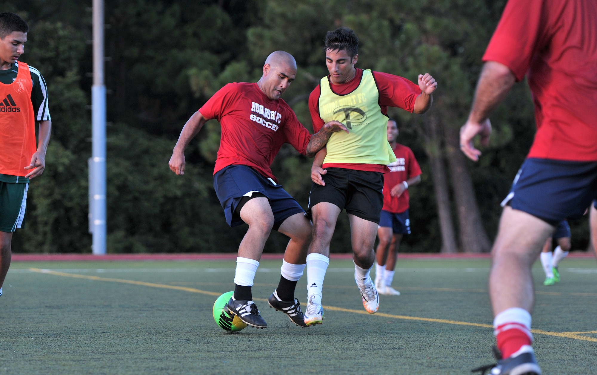 Hurburt Field Soccer Team Nick Sanchez, outside defender, and Michael Martinez, outside midfielder, fight for ball possesion during practice at the Aderholt Fitness Center Aug. 26, 2014. The practice is one of the last the players will have before departing for the 2014 Department of Defense Soccer Tournament. (U.S. Air Force photo/Senior Airman Kentavist P. Brackin)