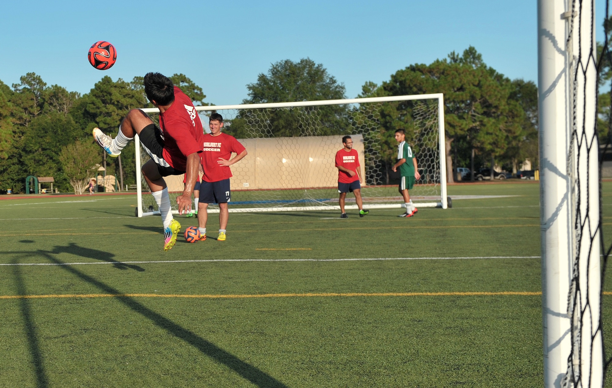 Michael Martinez, Hurburt Field Soccer Team, outside midfielder, attempts a bicycle kick during practice at the Aderholt Fitness Center Aug. 26, 2014. The base soccer team placed 5th in the 2013 Department of Defense Soccer Tournament. (U.S. Air Force photo/Senior Airman Kentavist P. Brackin)