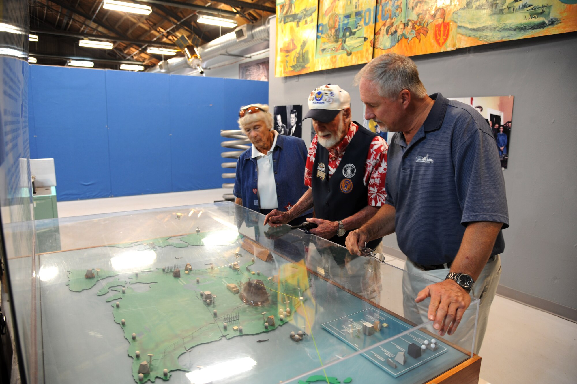 PETERSON AIR FORCE BASE, Colo. -- Al Horne (center), a tour guide at the Peterson Air and Space Museum, explains some of the museum artifacts to Betty Shafer and her son, Mike Shafer, 21st Civil Engineer Squadron, Aug. 8. Betty Shafer trained for the Women Airforce Service Pilots program in 1943. Throughout her life, she worked in the airline industry and flew her personal plane all over the country. (U.S. Air Force photo/Master Sgt. Kevin Williams)