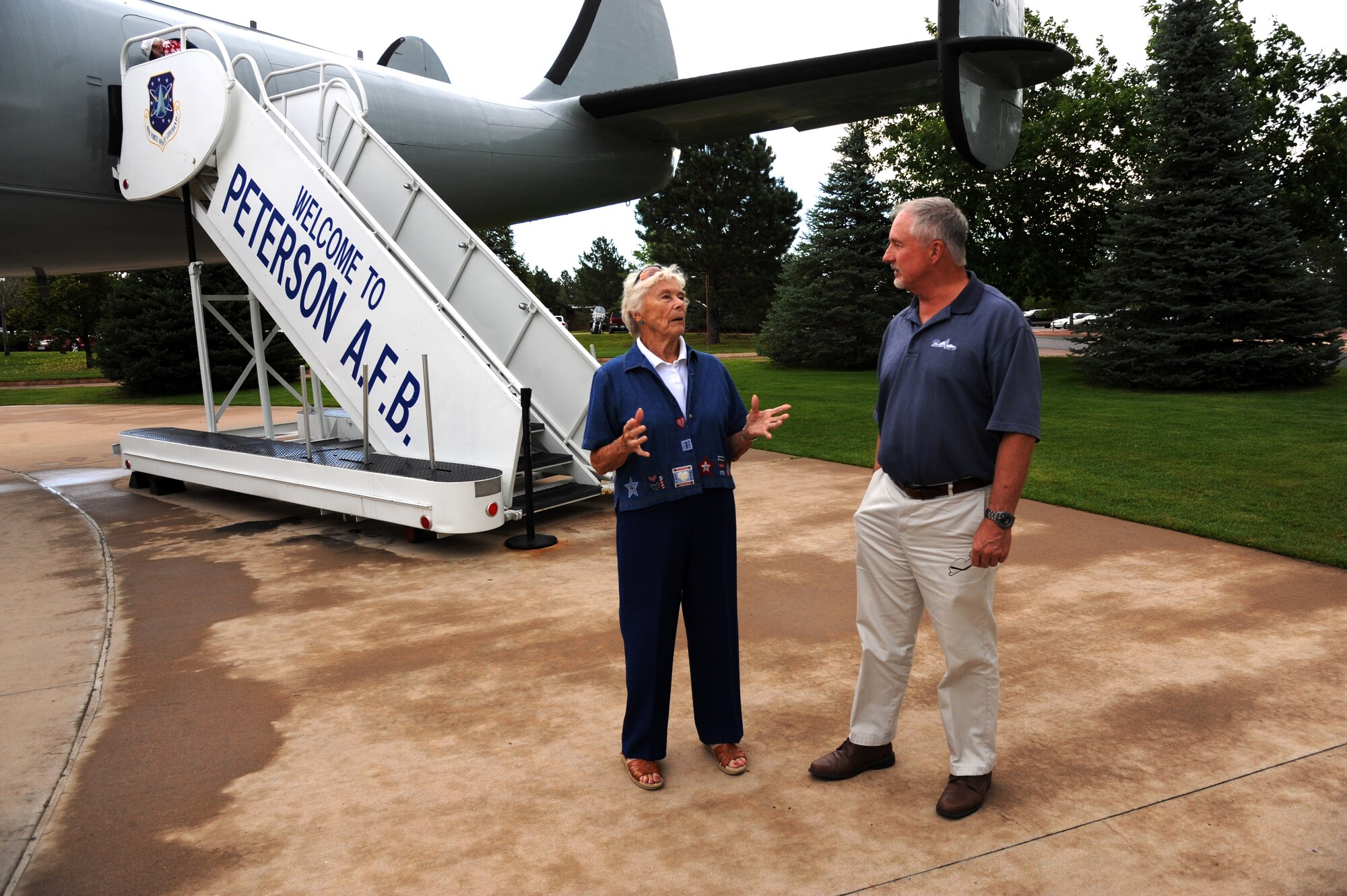 PETERSON AIR FORCE BASE, Colo. -- Betty Shafer talks with her son, Mike Shafer, 21st Civil Engineer Squadron, at the Peterson Air and Space Museum Aug. 8. Betty Shafer trained for the Women Airforce Service Pilots program in 1943. Throughout her life, she worked in the airline industry and flew her own plane all over the country. (U.S. Air Force photo/Master Sgt. Kevin Williams)