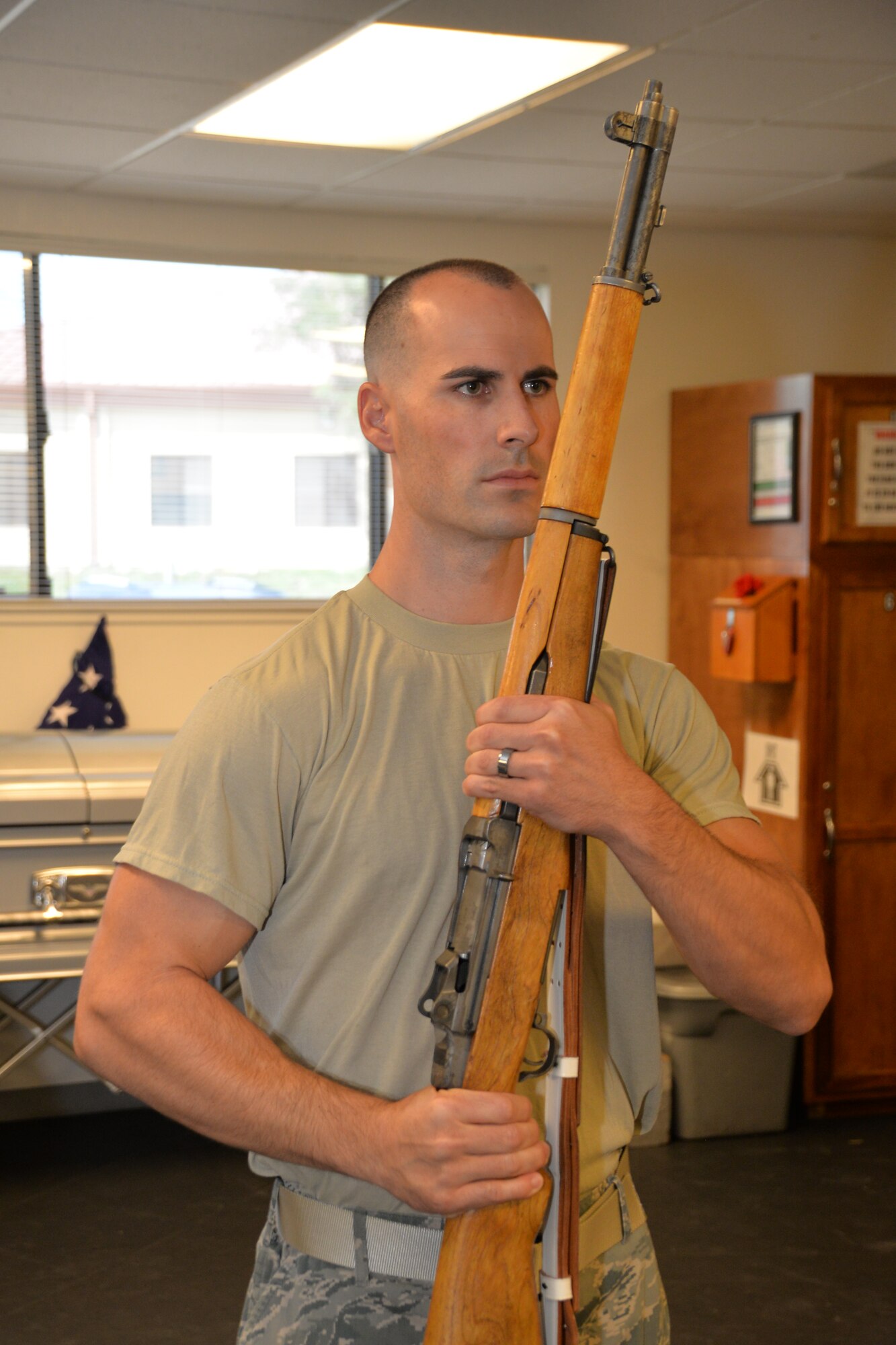 Tech. Sgt. Nicholas Cross, 45th Aerial Port Squadron, learns proper rifle movements for colors details during a week-long training with the Travis Honor Guard. Typically involving active-duty Airmen, this training consisted of only volunteers from the 349th Air Mobility Wing. (U.S. Air Force photo/Senior Airman Bryan Swink)