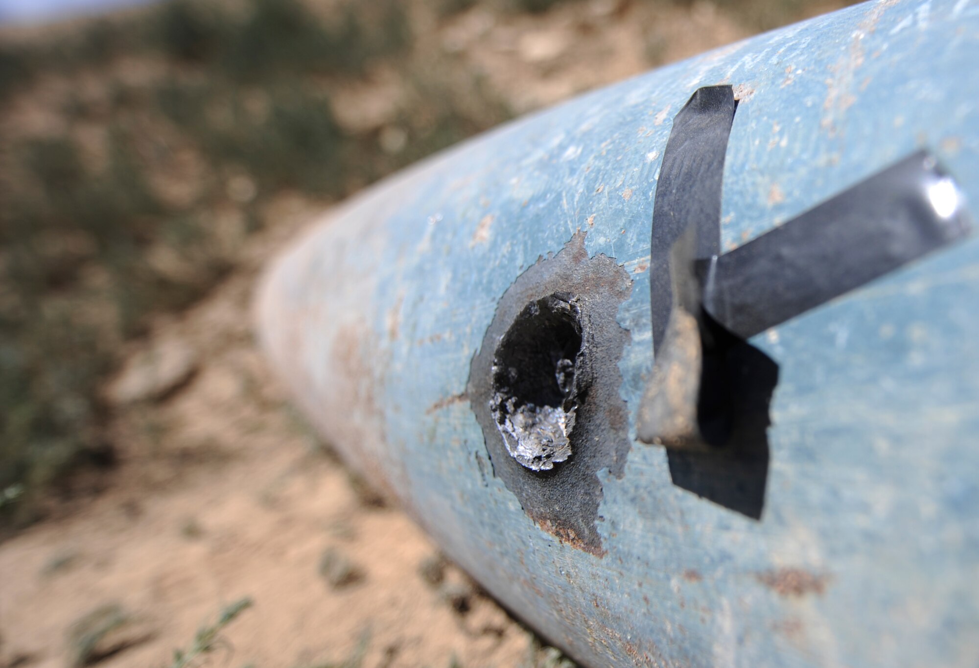 FORT CARSON, Colo. – The 21st Civil Engineer Squadron explosive ordnance disposal technicians lest a gaping hole through the middle of a BDU-50 bomb during shape charge training at Fort Carson’s Airburst Range Aug. 19. The EOD team goes to the range at Fort Carson about once a month to do upgrade training and stay proficient in their skills. (U.S. Air Force photo/Staff Sgt. Jacob Morgan)  