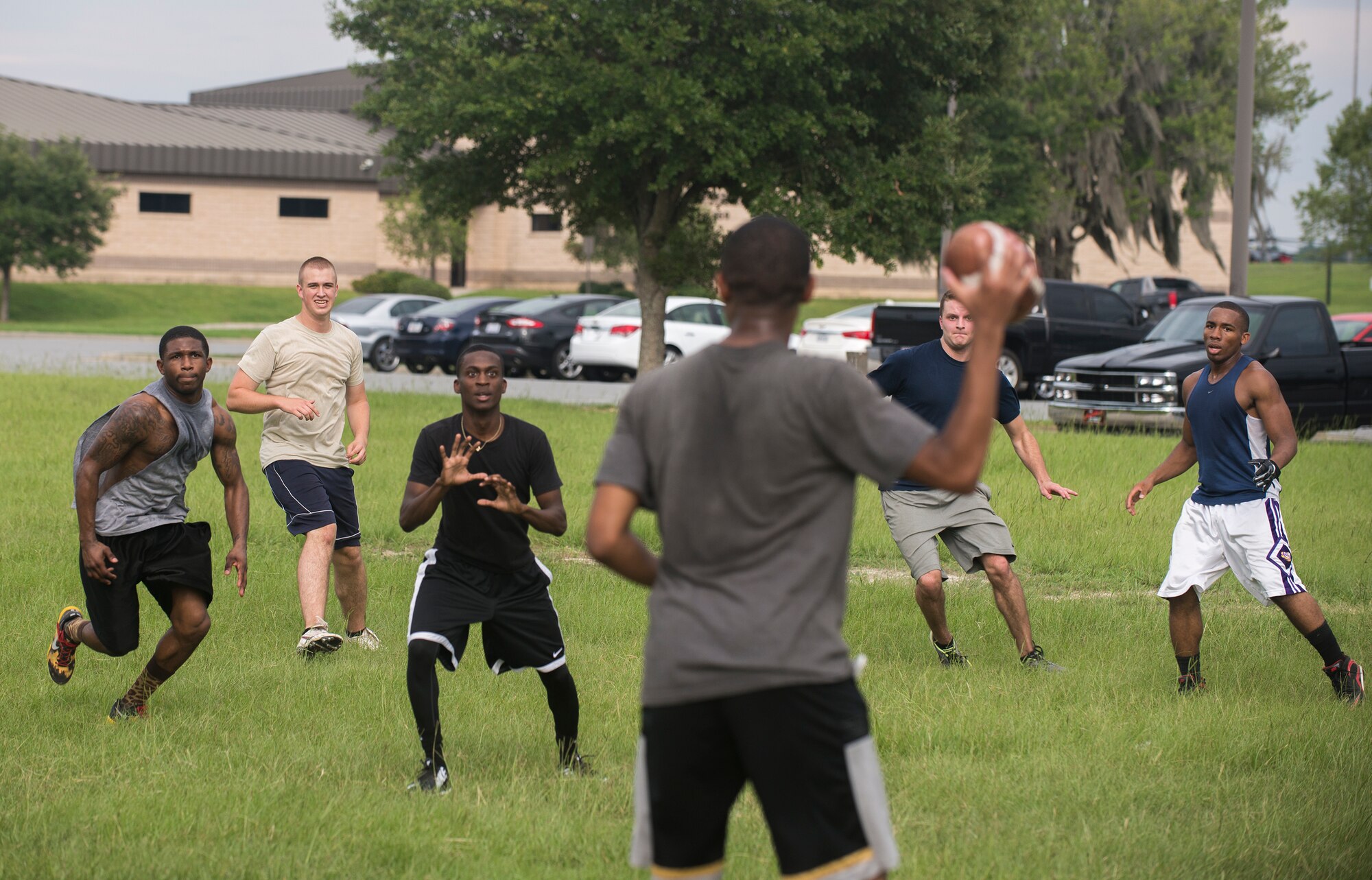 Members of the Component Maintenance Squadron intramural football team join for the first practice of the season at Moody Air Force Base, Ga., Aug. 27, 2014. The team scrimmaged in preparation for their first game. 
(U.S. Air Force photo by Airman 1st Class Sandra Marrero/Released)
