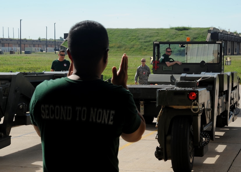 Senior Airman Christopher Wegner, 2nd Munitions Squadron nuclear weapons maintenance team member, performs the weapon's transport competition during the 2014 Global Strike Challenge on Barksdale Air Force Base, La., Aug. 27. The timed competition consisted of Airmen maneuvering a Material Handling Unit-196 through a series of cones. (U.S. Air Force photo/Staff Sgt. Sean Martin)