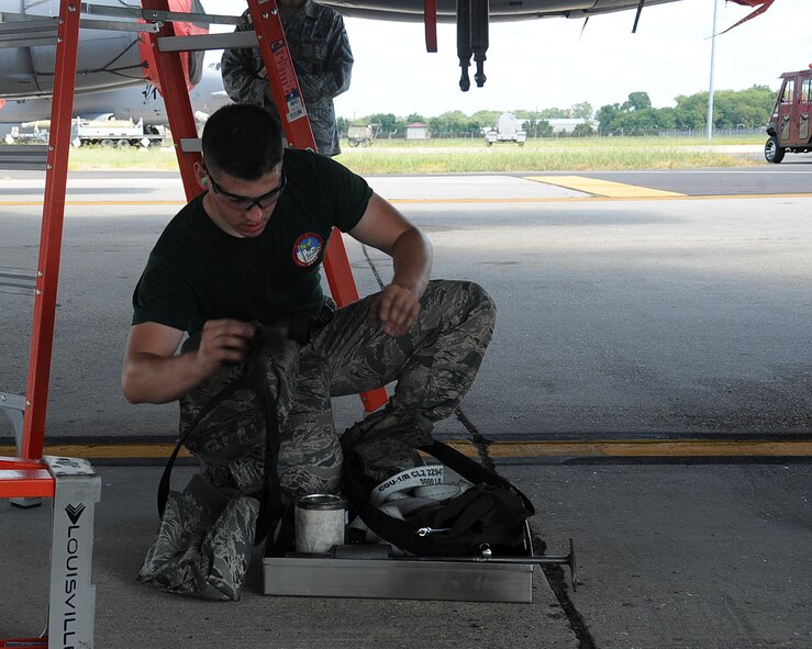 Staff Sgt. Caleb Nolen, 2nd Aircraft Maintenance Squadron weapons load team chief, puts tools away during the 2014 Global Strike Challenge on Barksdale Air Force Base, La., Aug. 26. Units competing in this year's challenge include the 90th Missile Wing, F.E. Warren Air Force Base, Wyo., the 91st Missile Wing and the 5th Bomb Wing, Minot Air Force Base, N.D., the 341st Missile Wing, Malmstrom Air Force Base, Mont., the 509th Bomb Wing, Whiteman Air Force Base and the 2nd Bomb Wing, Barksdale Air Force Base, La. (U.S. Air Force photo/Staff Sgt. Sean Martin)