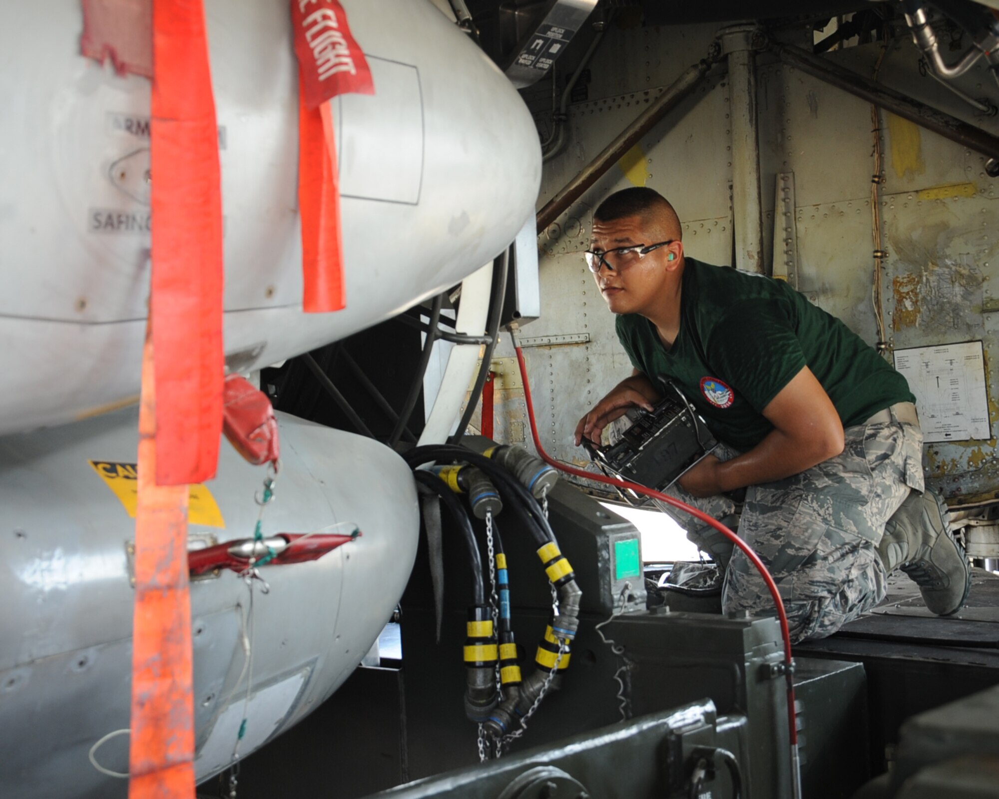 Senior Airman Anthony Rodriguez, 2nd Aircraft Maintenance Squadron weapons load team 2 man, raises AGM-86 Air Launch Cruise Missiles into the bomb bay of a B-52H Stratofortress during the 2014 Global Strike Challenge on Barksdale Air Force Base, La., Aug. 26.  The Global Strike Challenge is the world's premier bomber, Intercontinental Ballistic Missile, helicopter operations and security forces competition with units from Air Force Global Strike Command, Air Combat Command, Air Force Reserve Command and the Air National Guard. (U.S. Air Force photo/Staff Sgt. Sean Martin)
