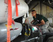 Senior Airman Anthony Rodriguez, 2nd Aircraft Maintenance Squadron weapons load team 2 man, raises AGM-86 Air Launch Cruise Missiles into the bomb bay of a B-52H Stratofortress during the 2014 Global Strike Challenge on Barksdale Air Force Base, La., Aug. 26.  The Global Strike Challenge is the world's premier bomber, Intercontinental Ballistic Missile, helicopter operations and security forces competition with units from Air Force Global Strike Command, Air Combat Command, Air Force Reserve Command and the Air National Guard. (U.S. Air Force photo/Staff Sgt. Sean Martin)
