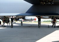 Airmen from the 2nd Aircraft Maintenance Squadron weapons load team open up the bomb bay of a B-52H Stratofortress during the 2014 Global Strike Challenge on Barksdale Air Force Base, La., Aug. 26.  The timed load consisted of the Airmen loading AGM-86 Air Launch Cruise Missiles into a B-52 using a common strategic rotary launcher. (U.S. Air Force photo/Staff Sgt. Sean Martin)