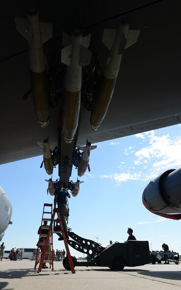 Airmen from the 2nd Aircraft Maintenance Squadron load a GBU-38 onto a B-52H Stratofortress on Barksdale Air Force Base, La., Aug. 27. In the load competition, four Airmen are evaluated on how quickly they loaded munitions on a B-52 and how many discrepancies were found. (U.S. Air Force photo/Senior Airman Benjamin Gonsier)