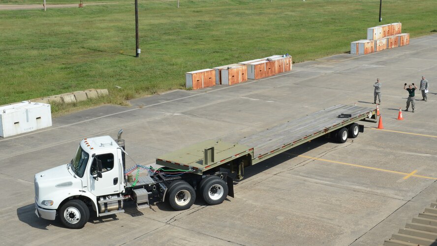 A ten ton tractor trailer backs up into a parking spot during the 2014 Global Strike Challenge on Barksdale Air Force Base, La., Aug. 26. Airmen from the 2nd Munitions Squadron competed on how quickly and precisely they were able to back up into a parking spot. (U.S. Air Force photo/Senior Airman Benjamin Gonsier)