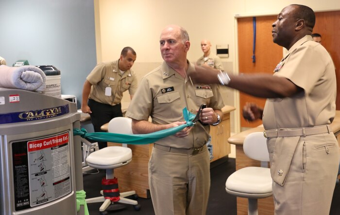 Vice Adm. Matthew Nathan, U.S. Navy Surgeon General and Bureau of
Medicine and Surgery chief, performs a theraband exercise at the Naval Health Clinic Charleston Physical Therapy department, Aug. 27, 2014, at Joint Base Charleston, S.C. During his visit, Nathan met with staff members to discuss U.S. Navy health care, medical readiness and joint service opportunities, had lunch with NHCC's civilians and Sailors of the Year, and held an “All Hands” call. (U.S. Air Force photo/Seaman Cody Meeks)

