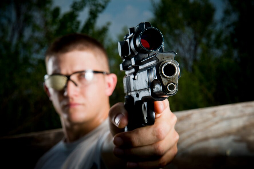 U.S. Air Force Staff Sgt. Jeremiah Jackson, 23d Equipment Maintenance Squadron aircraft metals technology craftsman, poses for a photo after pistol shooting practice in Valdosta, Ga., Aug. 15, 2014. Jackson is a member of the Air Force National Pistol Team and placed first out of all Air Force shooters during the National Rifle Association National Pistol Championships this past July. He also placed 40th overall out of 656 total participants in the event. (U.S. Air Force photo by Staff Sgt. Jamal D. Sutter/Released)   