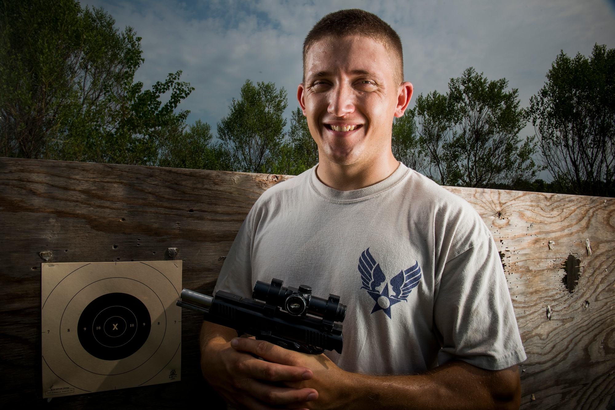 U.S. Air Force Staff Sgt. Jeremiah Jackson, 23d Equipment Maintenance Squadron aircraft metals technology craftsman, poses for a photo after pistol shooting practice Valdosta, Ga., Aug. 15, 2014. Jackson has been practicing and participating in pistol shooting competitions for four years. (U.S. Air Force photo by Staff Sgt. Jamal D. Sutter/Released)  