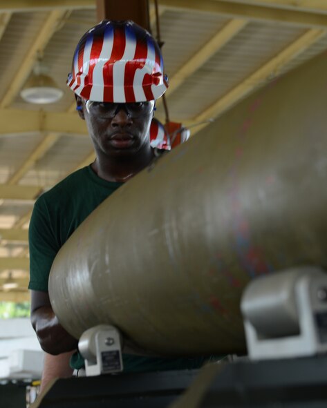 Airman 1st Class Cedric Brown, 2nd Munitions Squadron bomb build team, checks a GBU-38 as he builds it during the 2014 Global Strike Challenge on Barksdale Air Force Base, La., Aug. 26. The goal of the challenge is to showcase the world's premier bomber force and foster esprit de corps through competition and teamwork. (U.S. Air Force photo/Senior Airman Benjamin Gonsier)