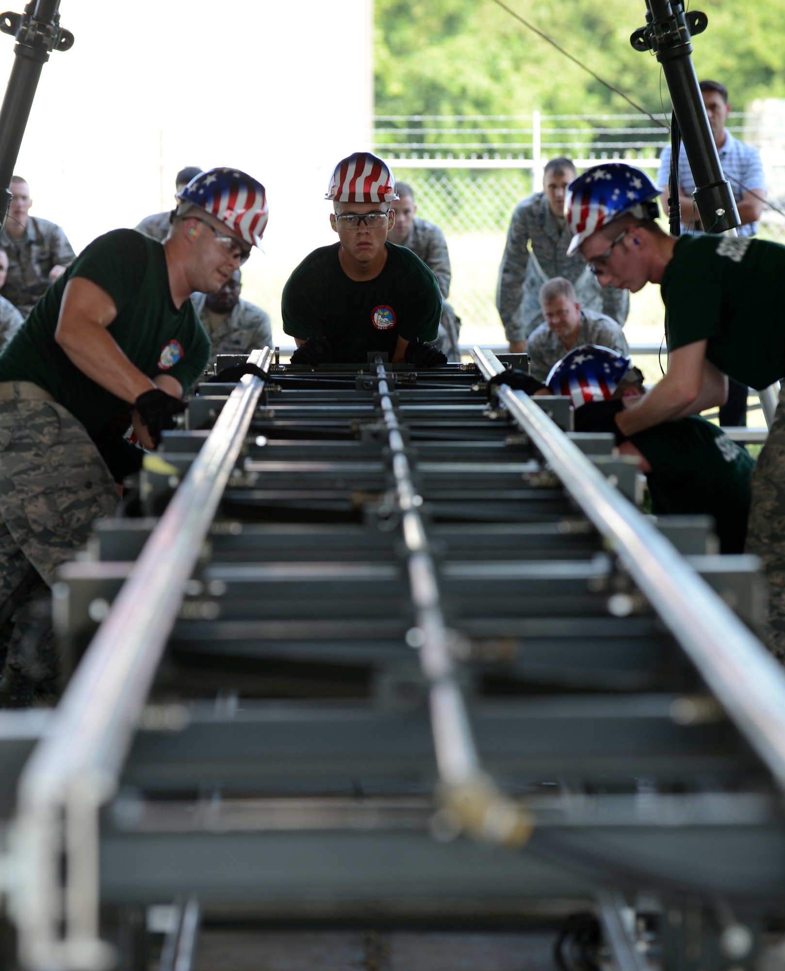 Airmen from the 2nd Munitions Squadron assemble a bomb trolley during the 2014 Global Strike Challenge on Barksdale Air Force Base, La., Aug. 26. During the bomb making process, the bomb trolley is used to hold and move munitions. (U.S. Air Force photo/Senior Airman Benjamin Gonsier)