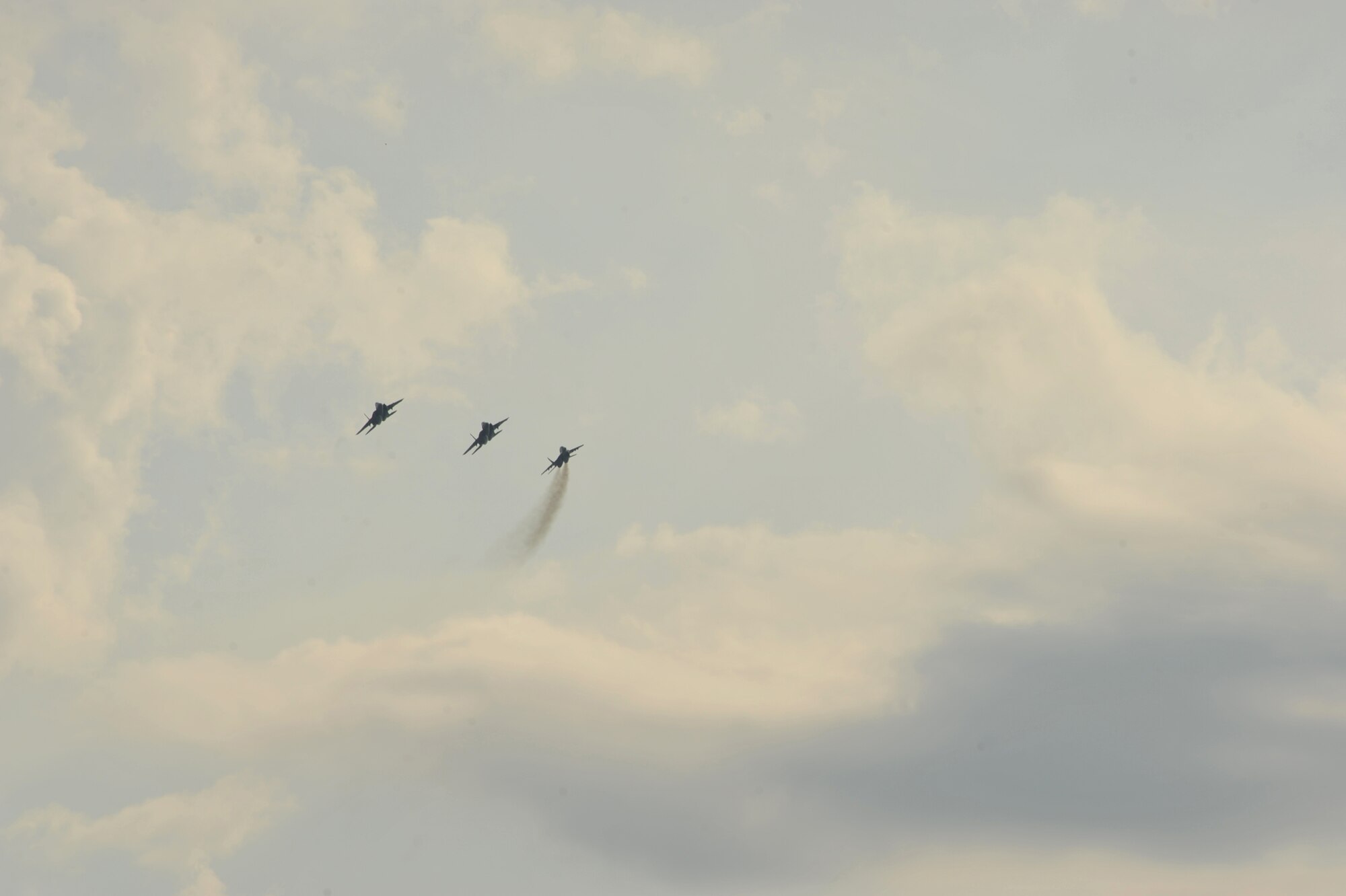 Two F-15C Eagles and a Bulgarian aircraft (right) fly in formation over Graf Ignatievo Air Base near Plovdiv, Bulgaria after conducting joint training in the skies Aug. 25, 2014. Pilots, maintainers and a mixture of other professions from RAF Lakenheath, including Airmen from Ramstein Air Base, Germany will enhance interoperability with Bulgaria and maintain joint readiness. (U.S. Air Force photo/Senior Airman Hailey Haux)