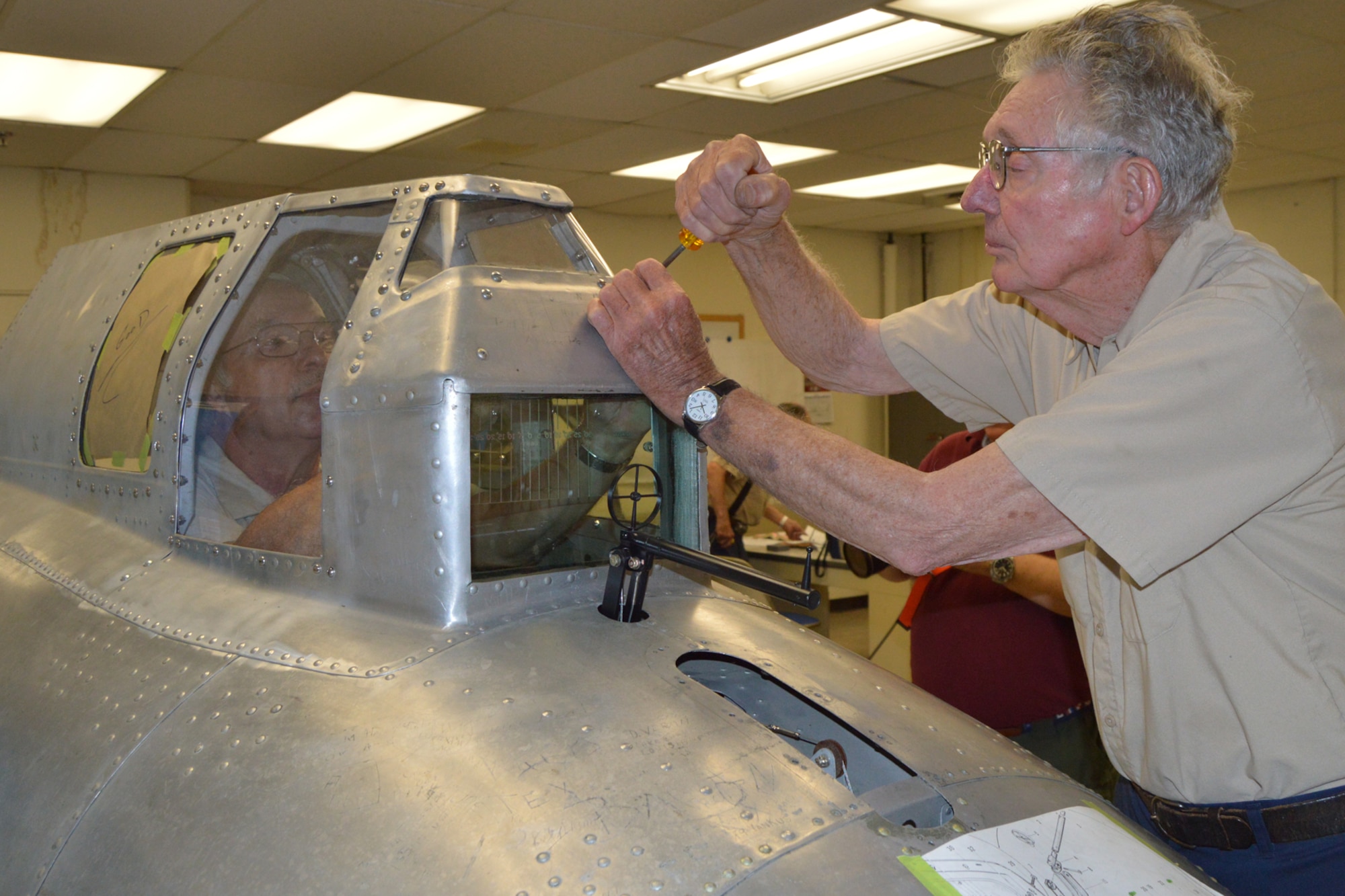 DAYTON, Ohio (08/2014) – Museum volunteers working on the "Memphis Belle" in the restoration hangar at the National Museum of the U.S. Air Force. (U.S. Air Force photo)
