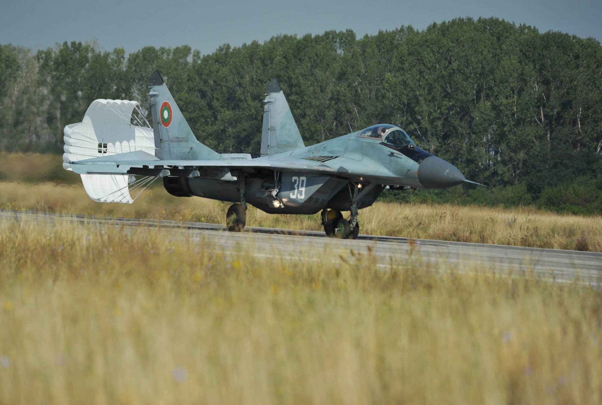 A Bulgarian aircraft lands after training with Bulgarian aircraft at Graf Ignatievo Air Base near Plovdiv, Bulgaria Aug. 21, 2014. Pilots, maintainers and a mixture of other professions from RAF Lakenheath, including Airmen from Ramstein Air Base, Germany will enhance interoperability with Bulgaria and maintain joint readiness. (U.S. Air Force photo/Senior Airman Hailey Haux)