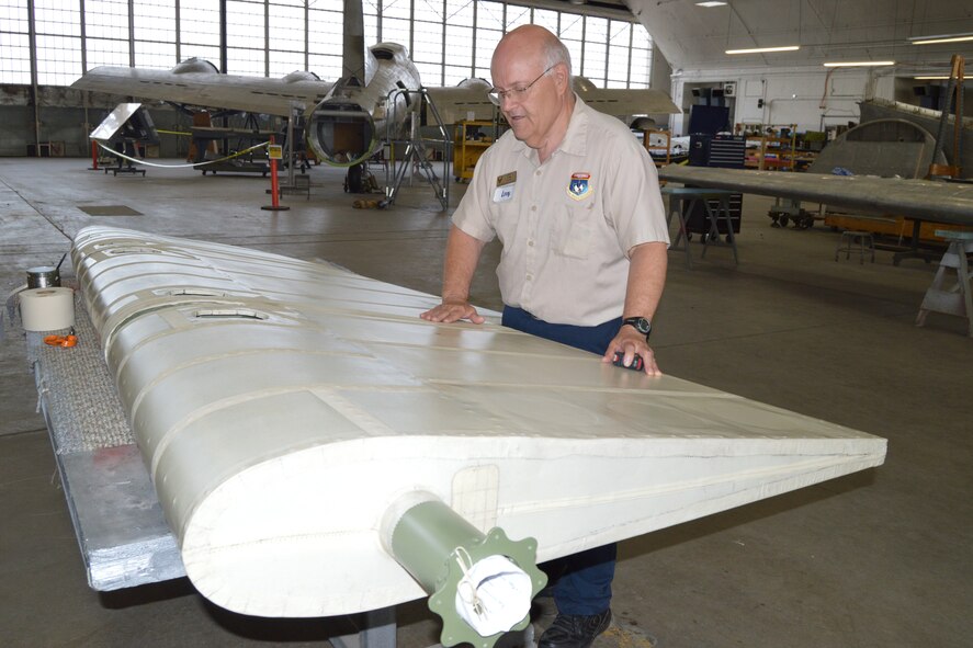 DAYTON, Ohio (08/2014) – A museum volunteer working on the "Memphis Belle" in the restoration hangar at the National Museum of the U.S. Air Force. (U.S. Air Force photo)